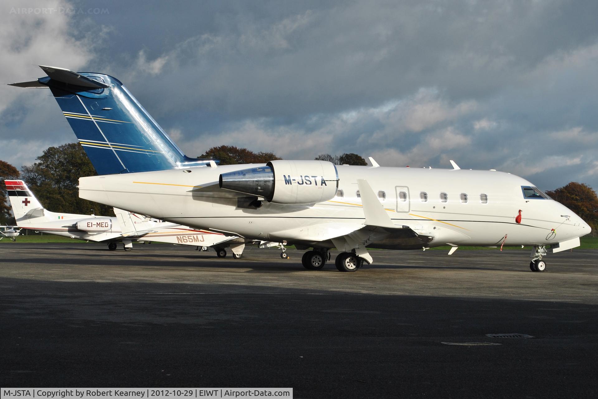 M-JSTA, 2005 Bombardier Challenger 604 (CL-600-2B16) C/N 5639, Parked on the ramp at Weston