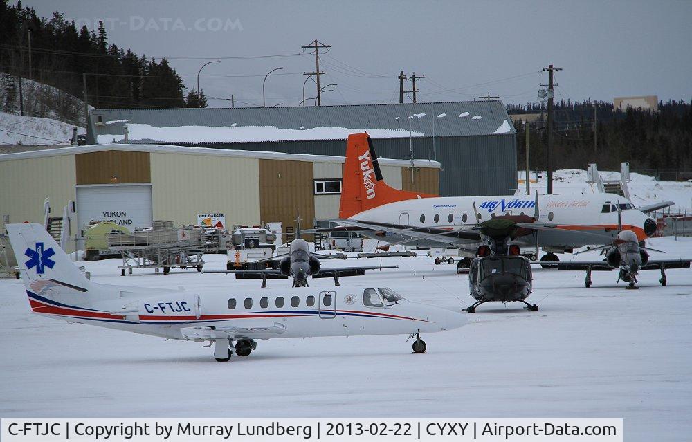 C-FTJC, 2000 Cessna 560 Citation Encore C/N 560-0544, On the ramp at YXY as aircraft are gathering for the Sourdough Rendezvous winter air show.