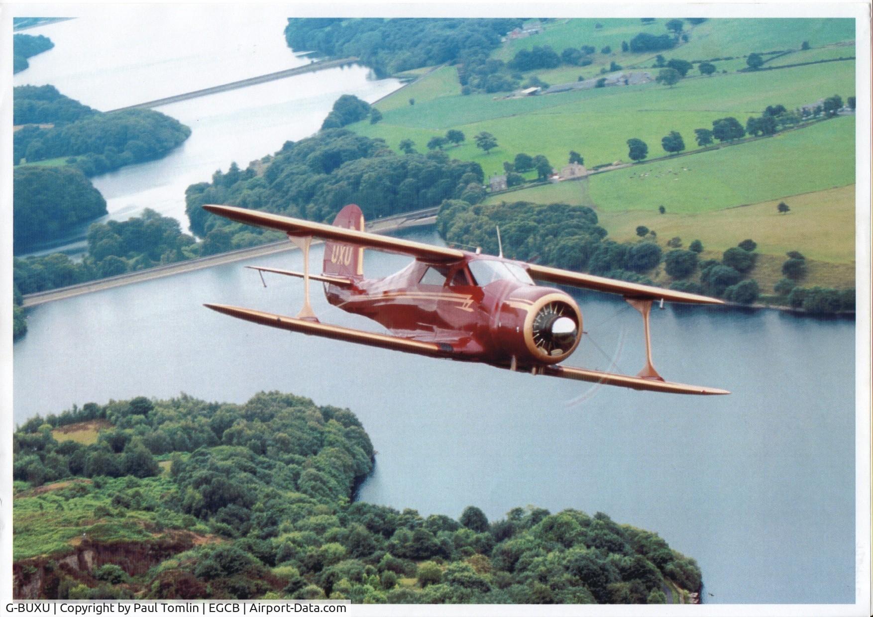 G-BUXU, 1943 Beech D17S Staggerwing C/N 4823, Beechcraft Staggerwing D17S  while on British register as G-BUXU before delivery to France. Flown by Nigel Jones Photographed from Cessna 172B G-ARMR