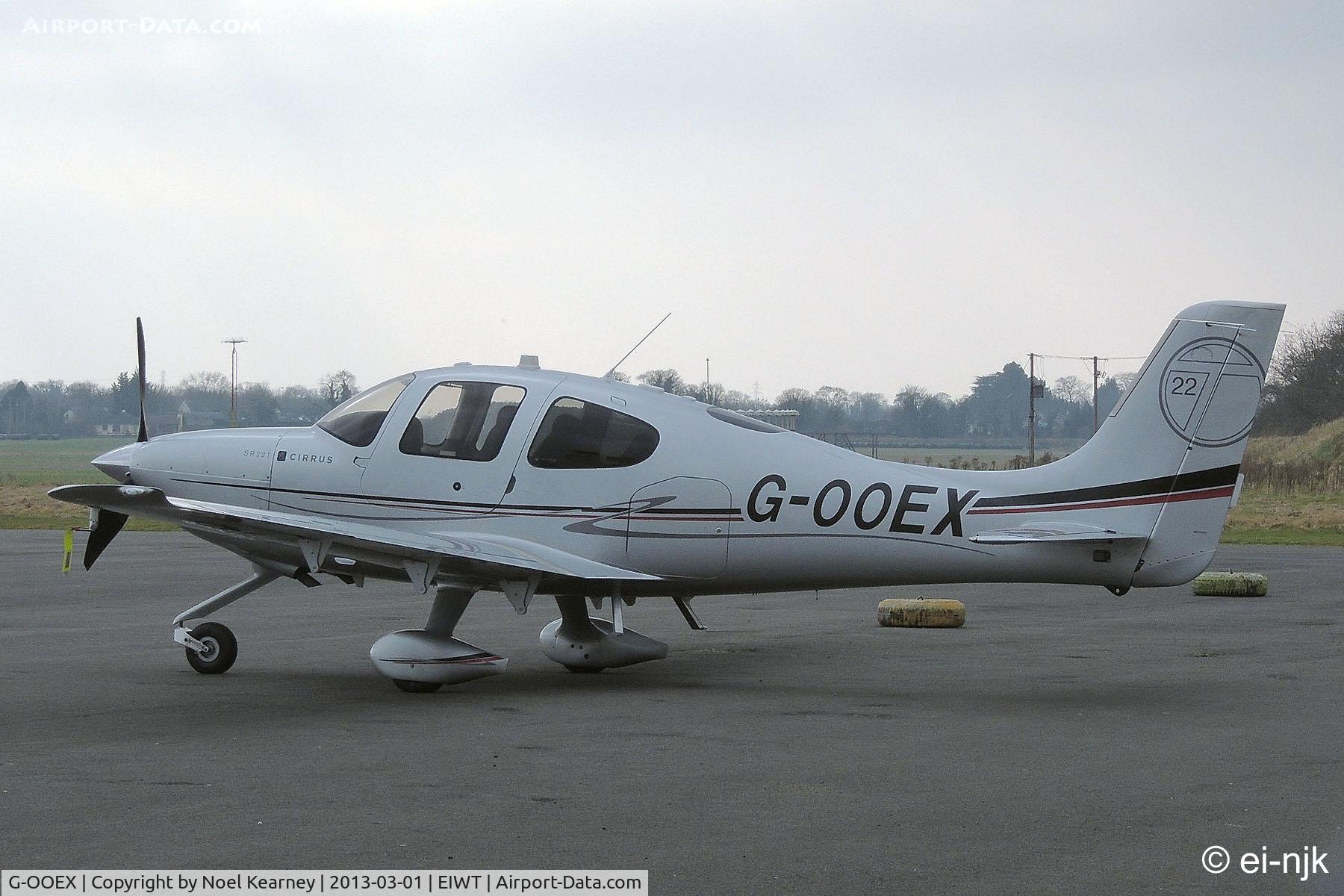 G-OOEX, 2010 Cirrus SR22T C/N 0010, Parked on the apron at Weston.