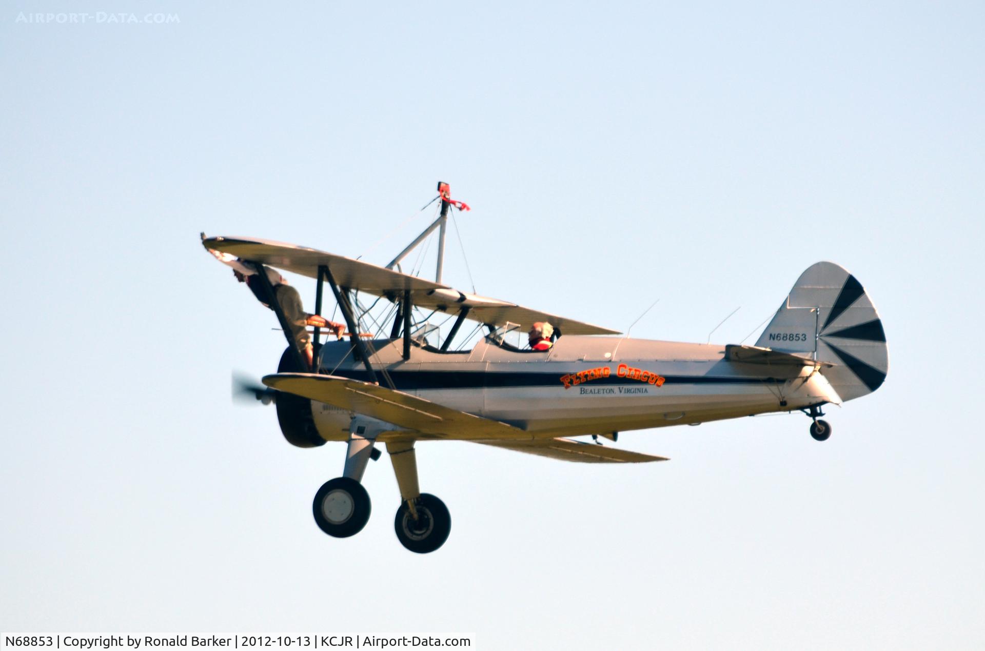 N68853, Boeing A75N1(PT17) C/N 75-5418, Wing walker - Leaning forward on left wing - Flying Circus - Culpeper Air Fest 2012