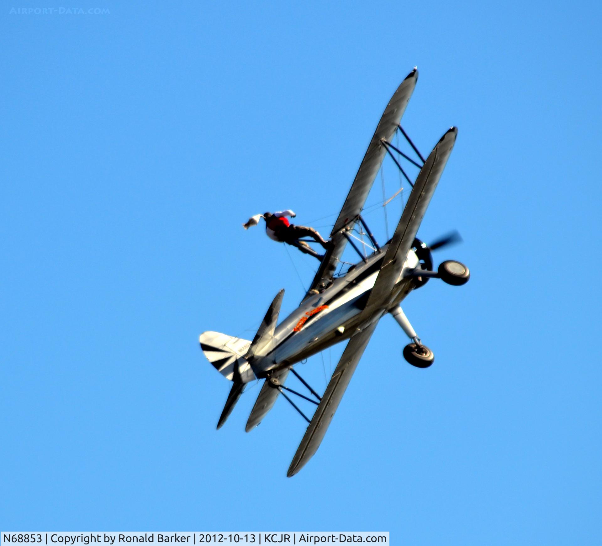 N68853, Boeing A75N1(PT17) C/N 75-5418, Wing walker - standing on top in climb - Flying Circus - Culpeper Air Fest 2012