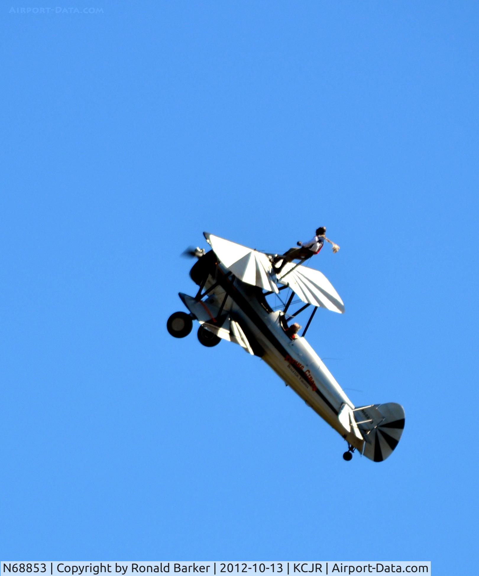 N68853, Boeing A75N1(PT17) C/N 75-5418, Wing walker - on top of aircraft in climb - Flying Circus - Culpeper Air Fest 2012