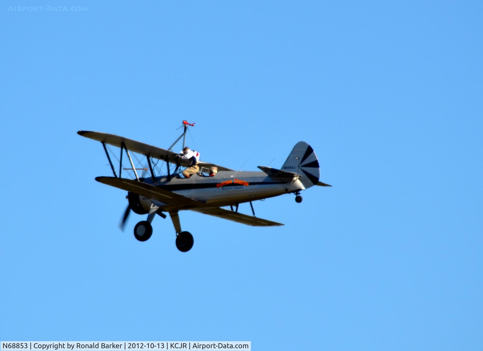N68853, Boeing A75N1(PT17) C/N 75-5418, Wing walker climbing back into the aircraft - Flying Circus - Culpeper Air Fest 2012