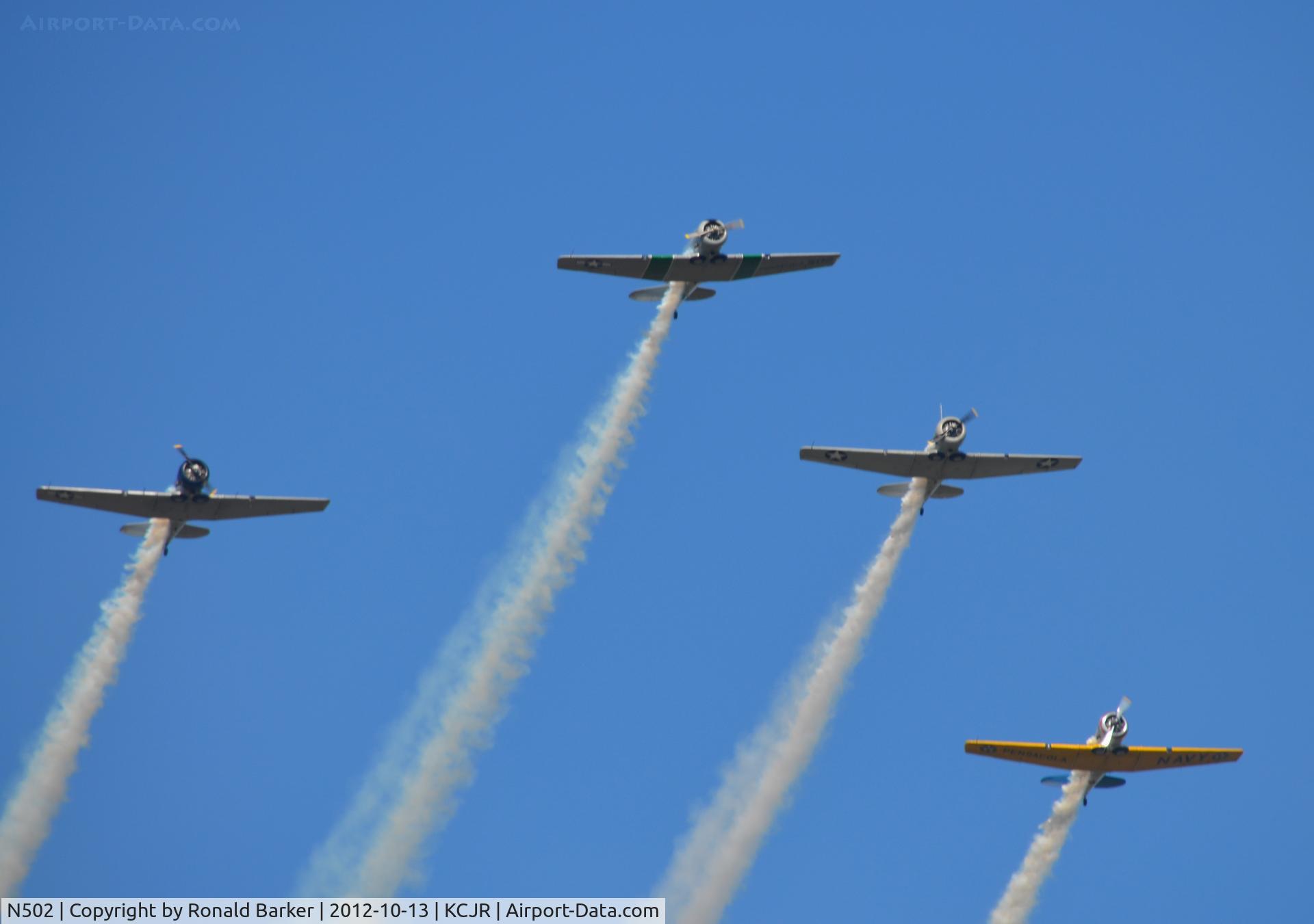 N502, 1941 North American SNJ-5 Texan Texan C/N 43689, N502 leading, N796WM on left and N9801C and N211A on the right , Culpeper Air Fest 2012