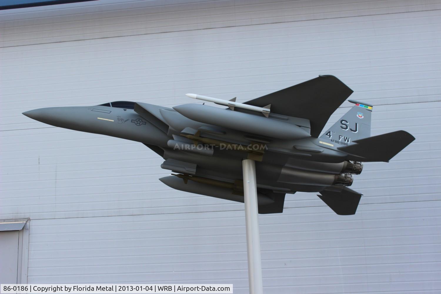 86-0186, 1987 McDonnell Douglas F-15E Strike Eagle C/N 1015/E004, F-15 Model replica with Seymour Johnson tail code at the entrance to Warner Robbins Aviation Museum