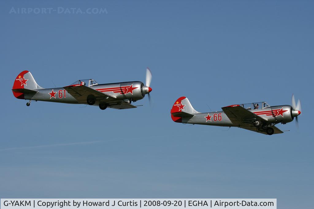 G-YAKM, 1984 Yakovlev Yak-50 C/N 842710, 61 red, with Yak-52 G-YAKN/66 red.