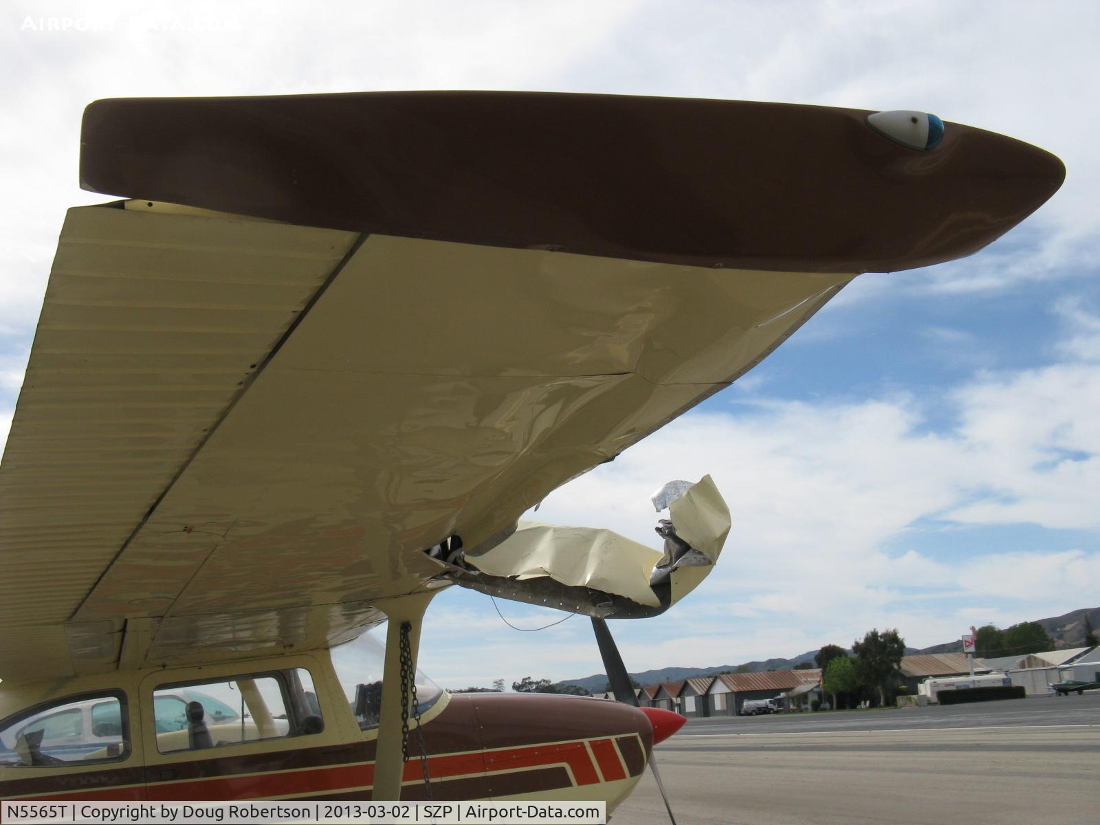 N5565T, 1964 Cessna 172E C/N 17251465, 1964 Cessna 172E, Continental O-300 145 Hp, wing & fuselage damage from being hit by a red N17445 1931 Waco QCF biplane departure while landing Rwy 22, which see. N5565T totaled by owner's insurance company.