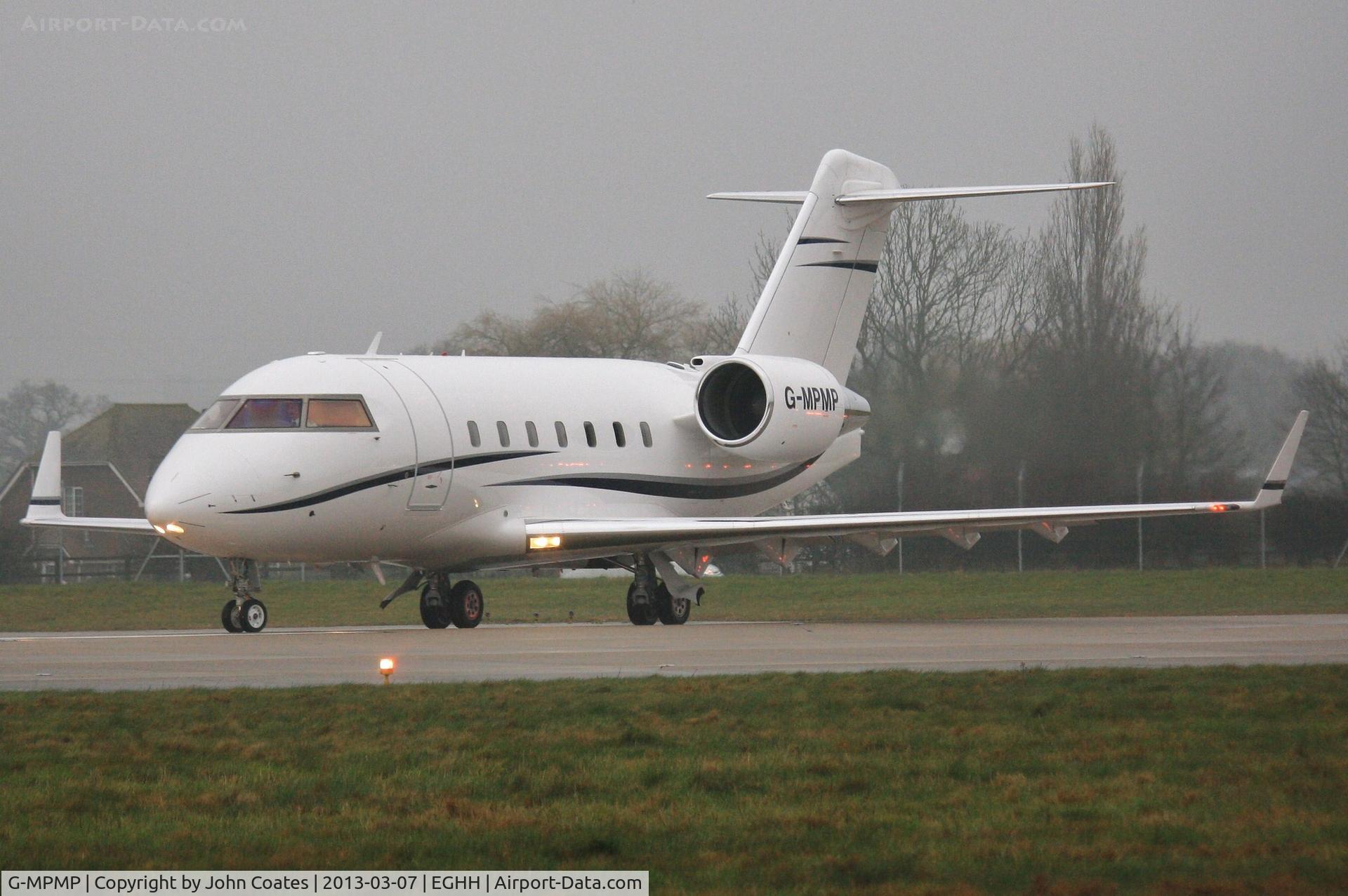 G-MPMP, 2001 Bombardier Challenger 604 (CL-600-2B16) C/N 5528, Interesting light reflections in the mist and drizzle.