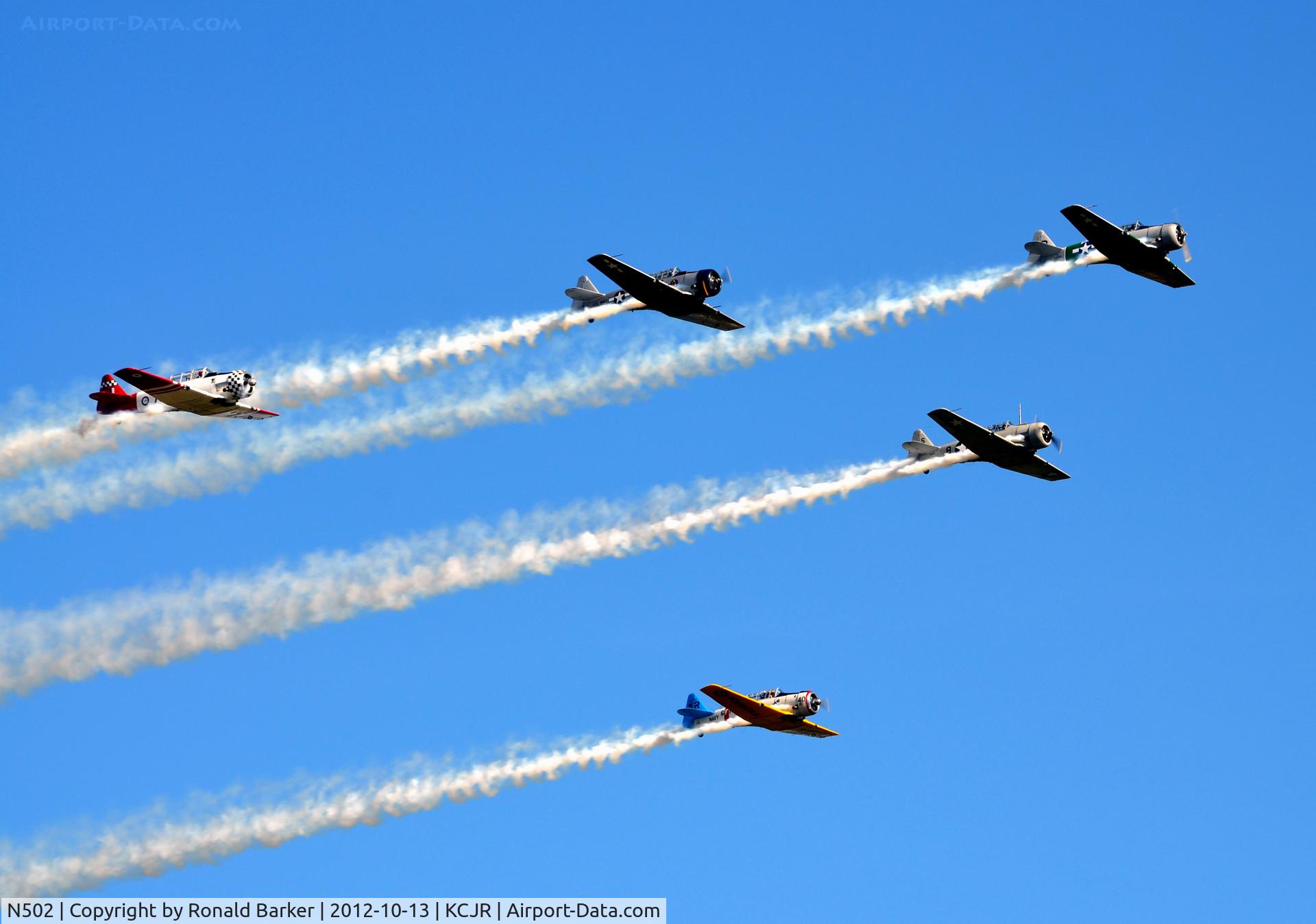 N502, 1941 North American SNJ-5 Texan Texan C/N 43689, Five ship lead by N502, N796WM and N7572 left, N9801C and N211 right - Culpeper Air Fest 2012