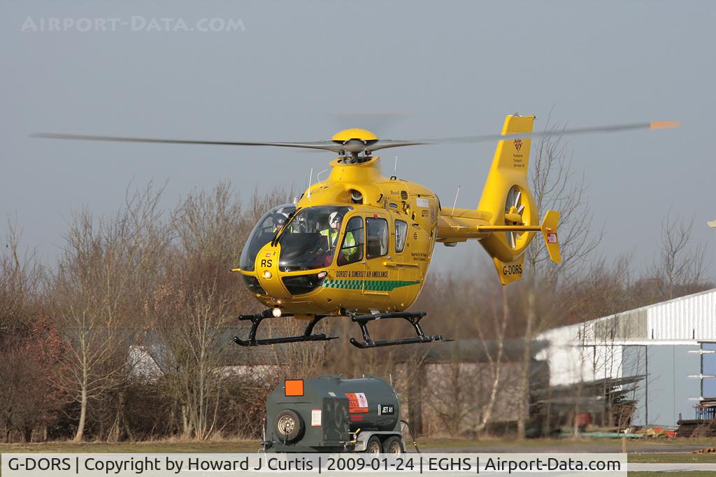 G-DORS, 2006 Eurocopter EC-135T-2+ C/N 0517, Dorset & Somerset Air Ambulance, lifting off from its base.