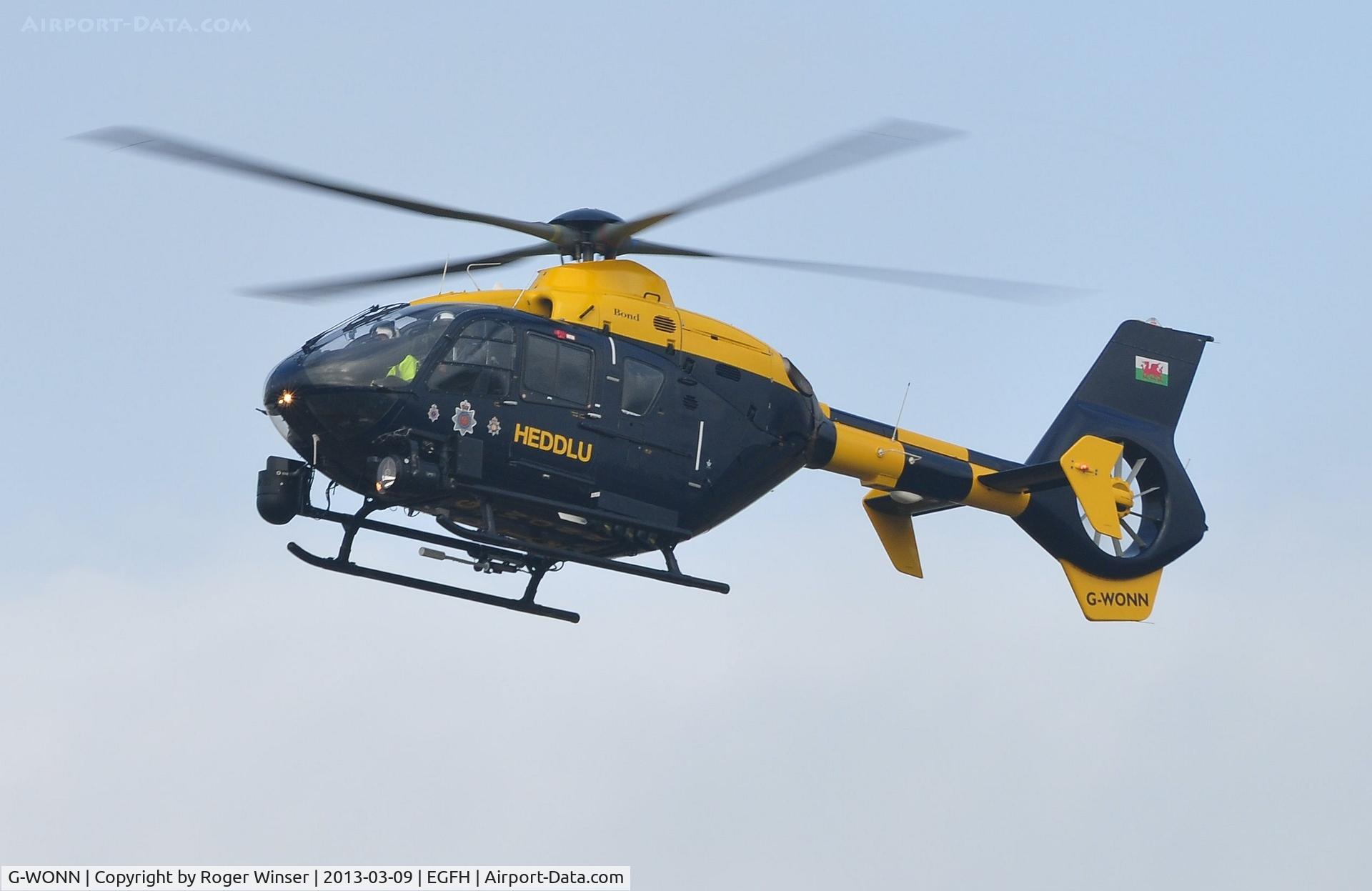 G-WONN, 2007 Eurocopter EC-135T-2+ C/N 0597, South and East Wales Police Air Support Unit helicopter (Police 32) arriving at Swansea Airport. Marked POLICE on the starboard side.