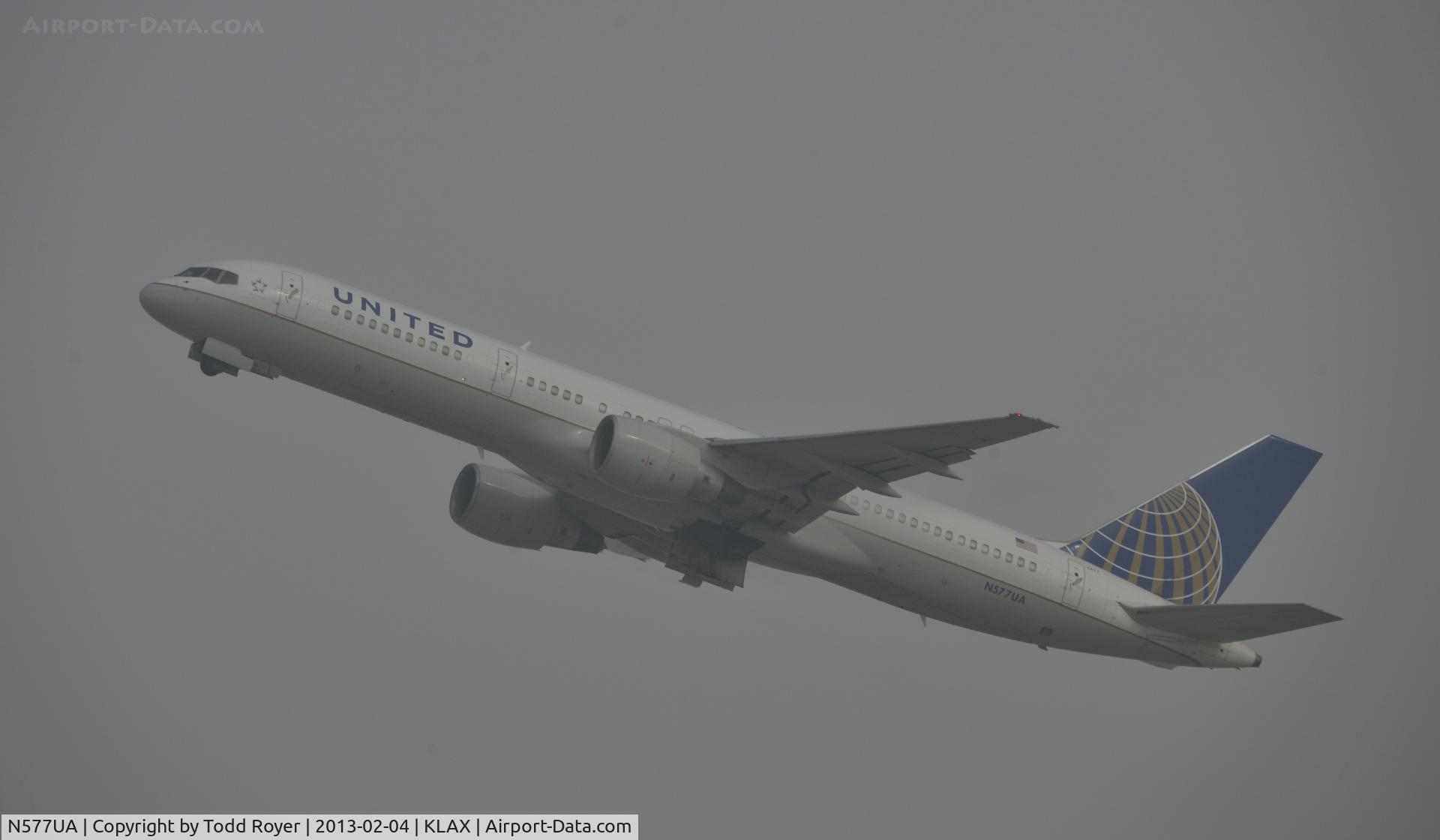 N577UA, 1993 Boeing 757-222 C/N 26693, Departing LAX on a foggy morning
