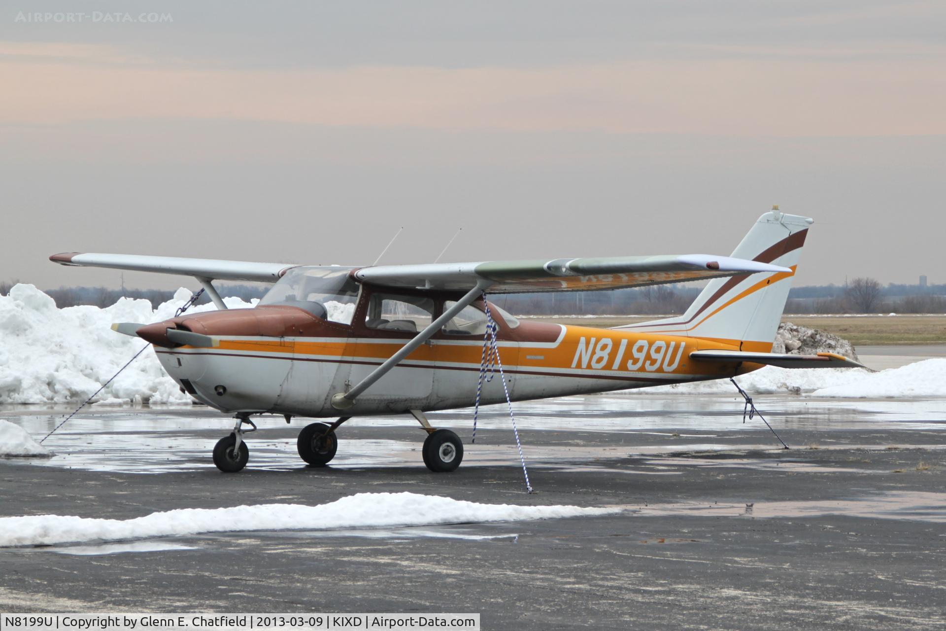 N8199U, 1964 Cessna 172F C/N 17252099, Parked on the wet ramp