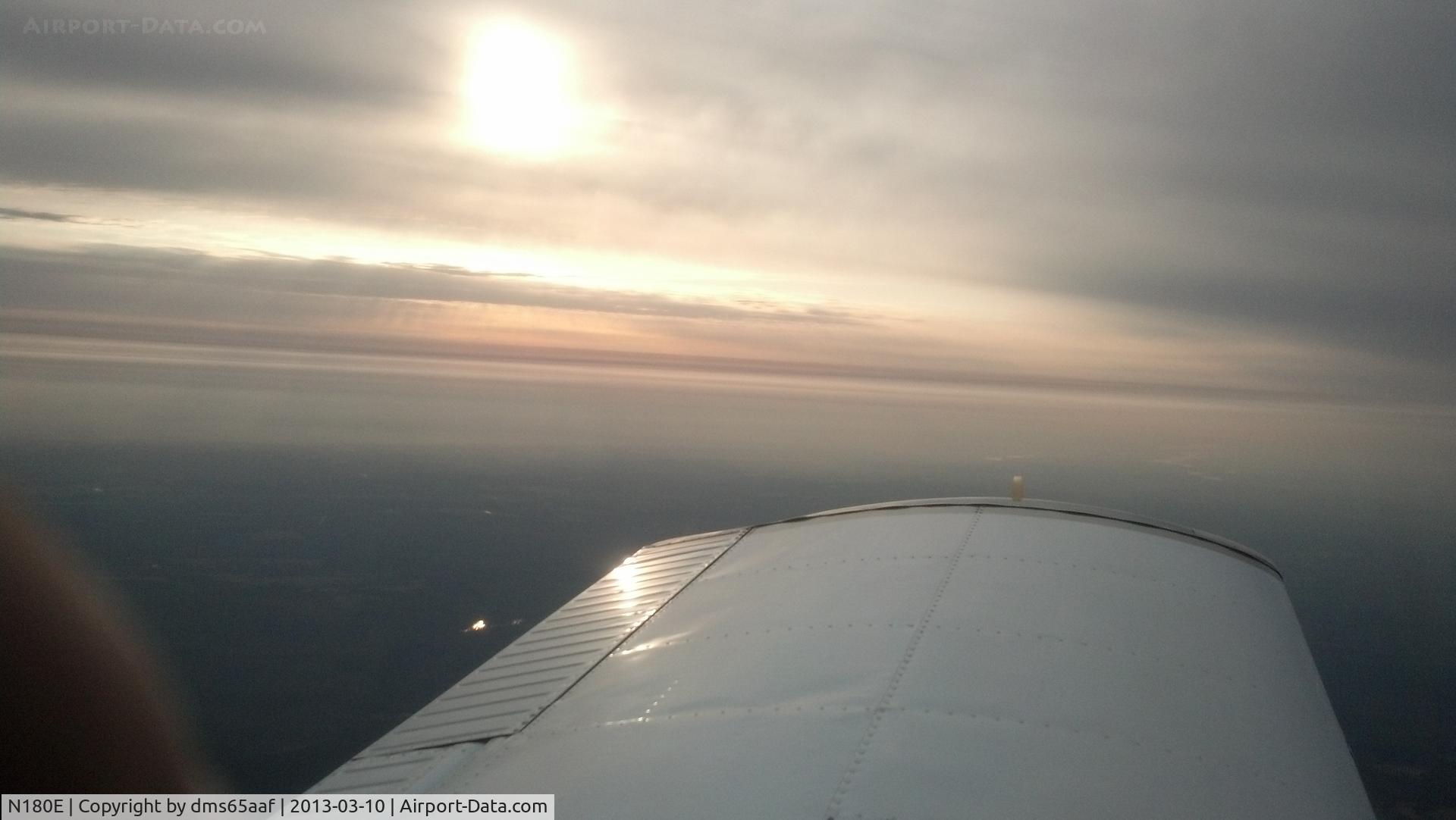 N180E, 1969 Piper PA-28-180 C/N 28-5373, On the flight home after purchase. 
South Carolina sunrise.