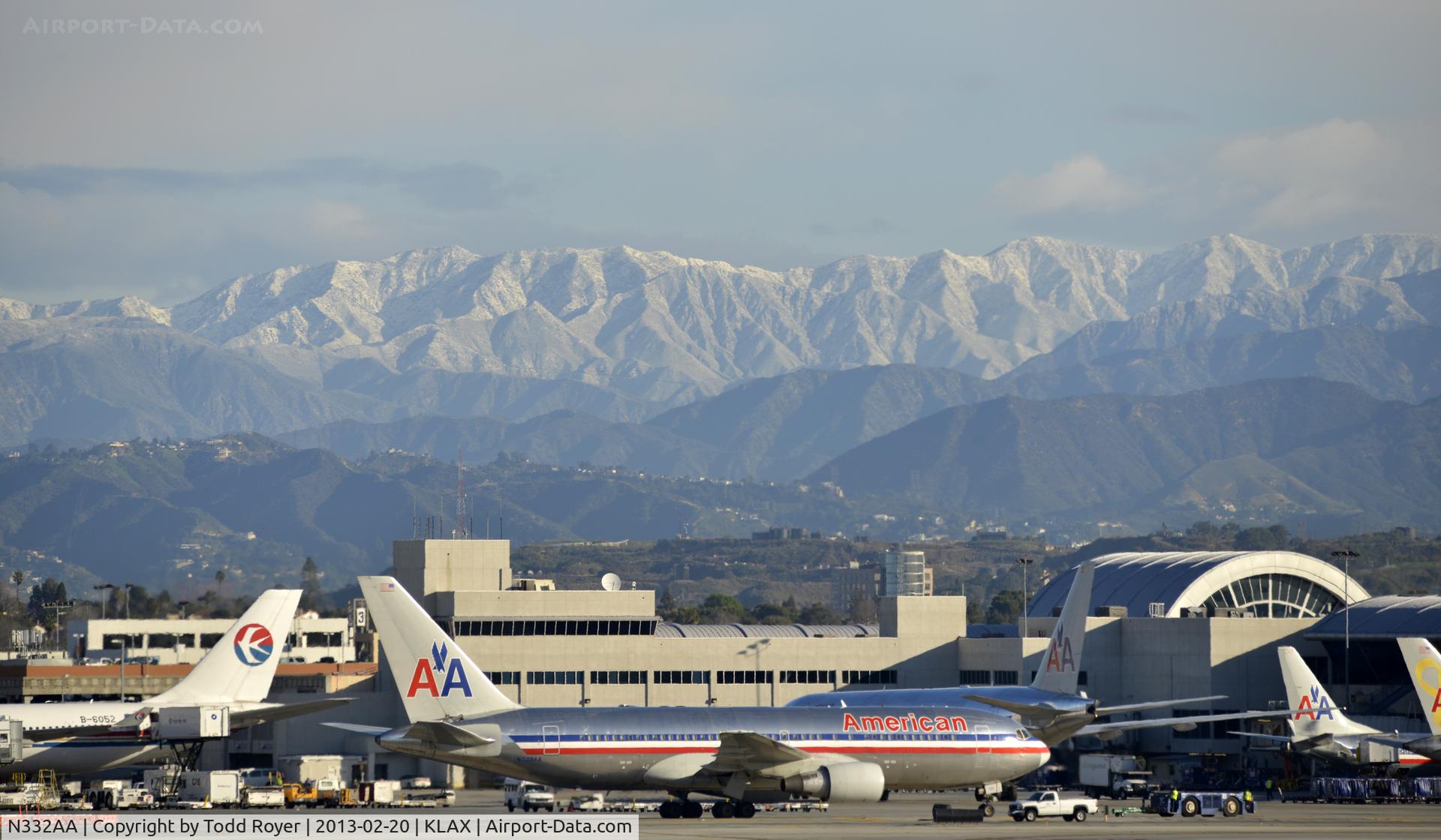N332AA, 1987 Boeing 767-223 C/N 22331, Taxiing to gate under snow capped mountains