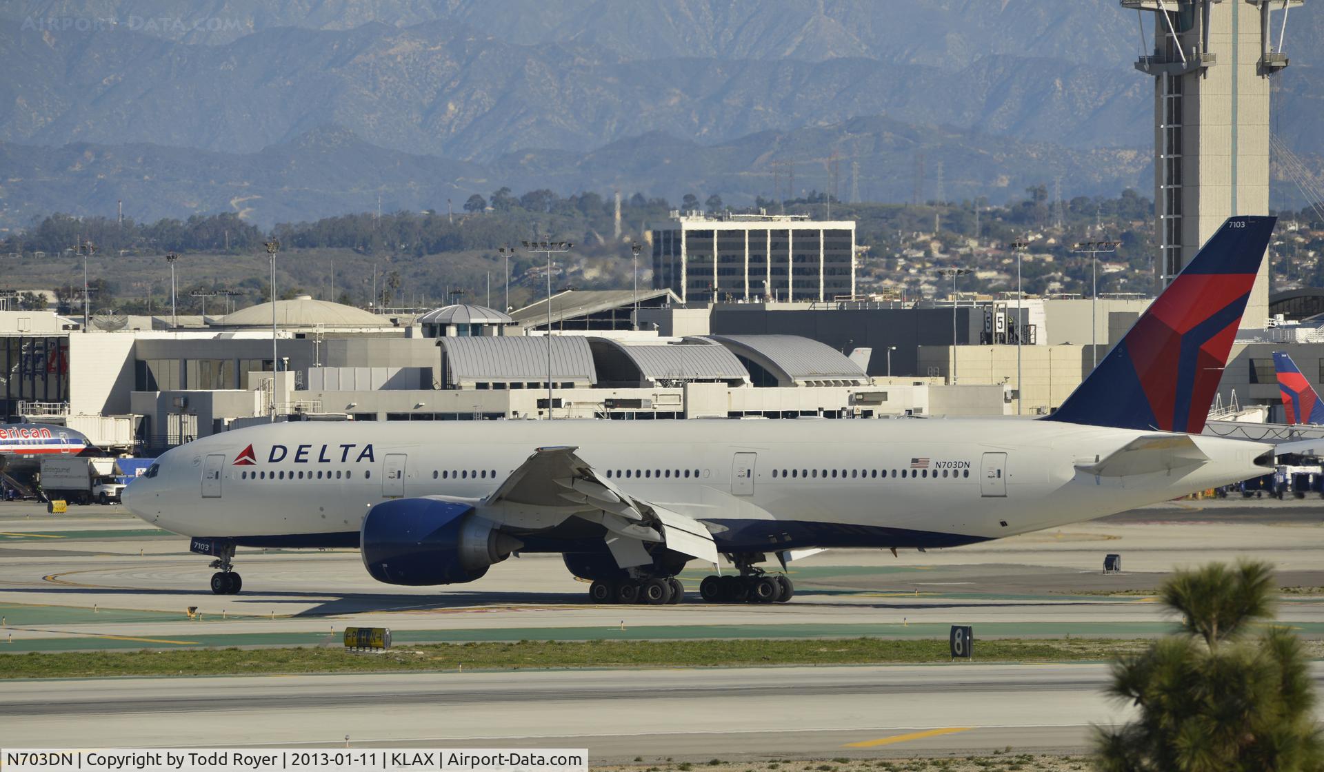 N703DN, 2009 Boeing 777-232/LR C/N 32222, Taxiing to gate at LAX