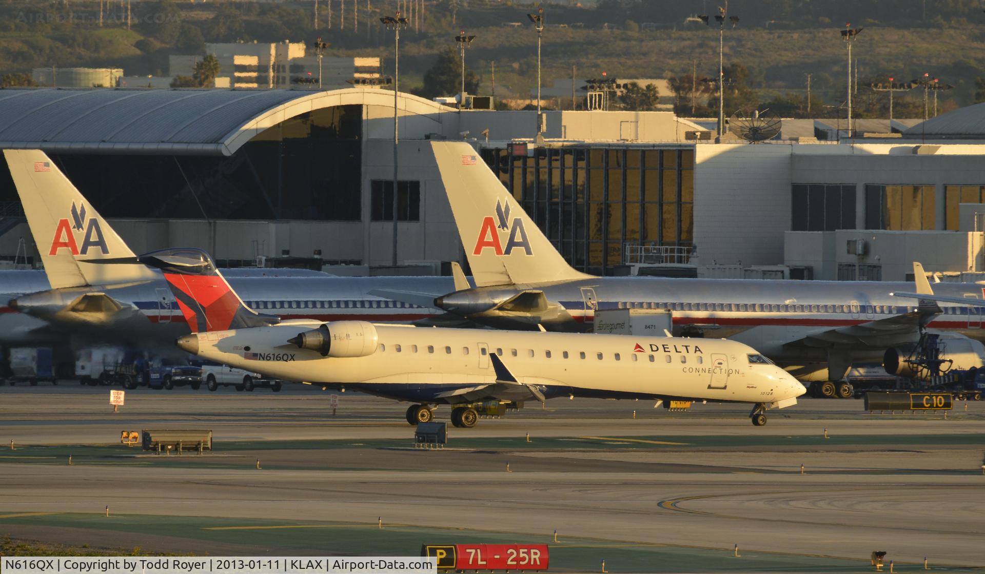 N616QX, 2003 Bombardier CRJ-701 (CL-600-2C10) C/N 10128, Taxiing to gate at LAX