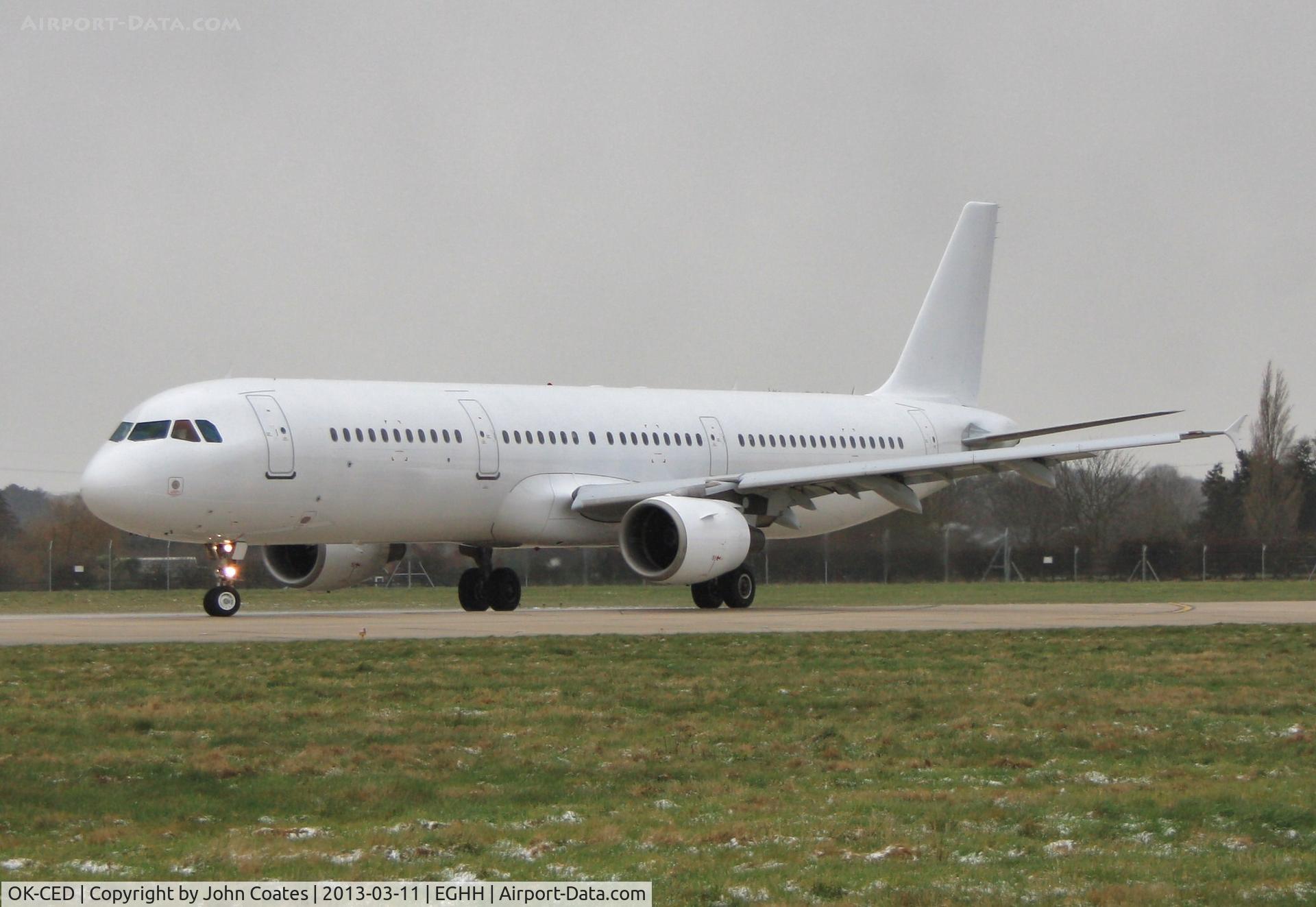 OK-CED, 1997 Airbus A321-211 C/N 684, Departs in fine snow back to Prague with new Polar Bear scheme