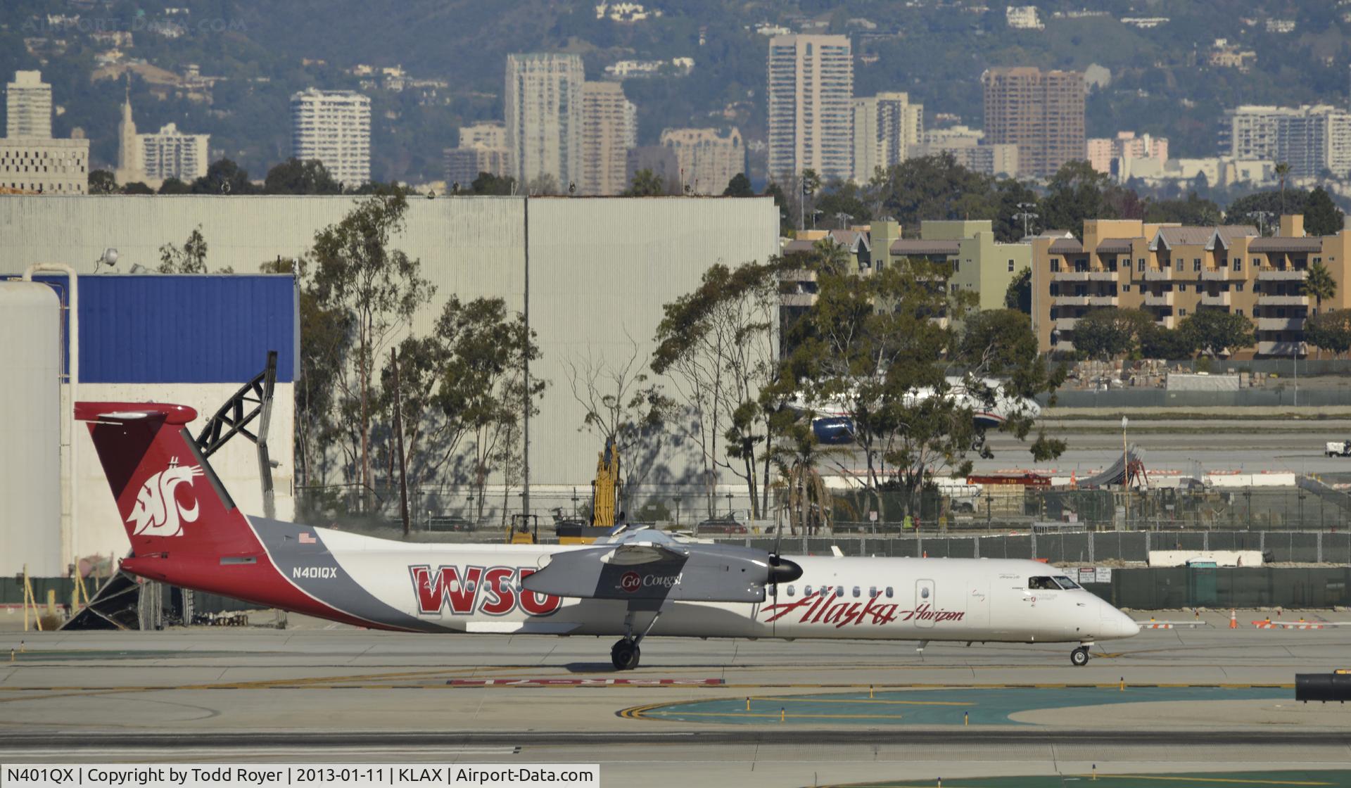 N401QX, 2001 De Havilland Canada DHC-8-402 Dash 8 C/N 4031, Taxiing to gate