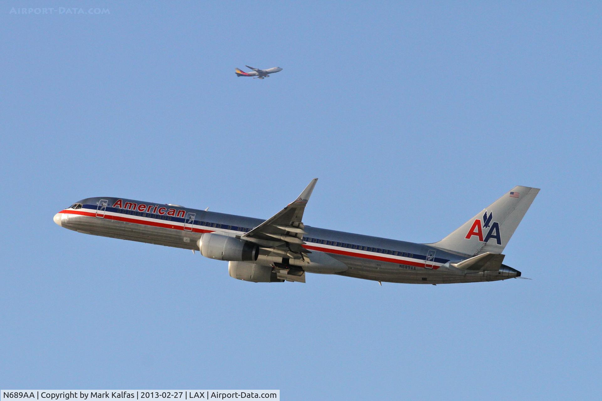 N689AA, 1993 Boeing 757-223 C/N 25731, American #297 departing 25R for HNL, and Asiana Cargo # 284 from Incheon Int'l is on a downwind for 24R at Los Angeles International Airport.
