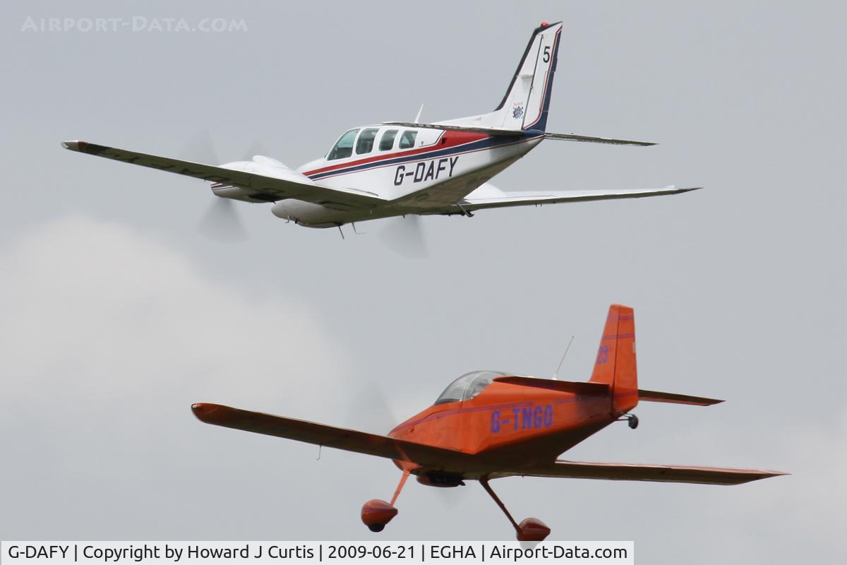 G-DAFY, 1990 Beech 58 Baron C/N TH-1591, At the Dorset Air Races. Privately owned. Race code: 5, with RV-6 G-TNGO on its tail.
