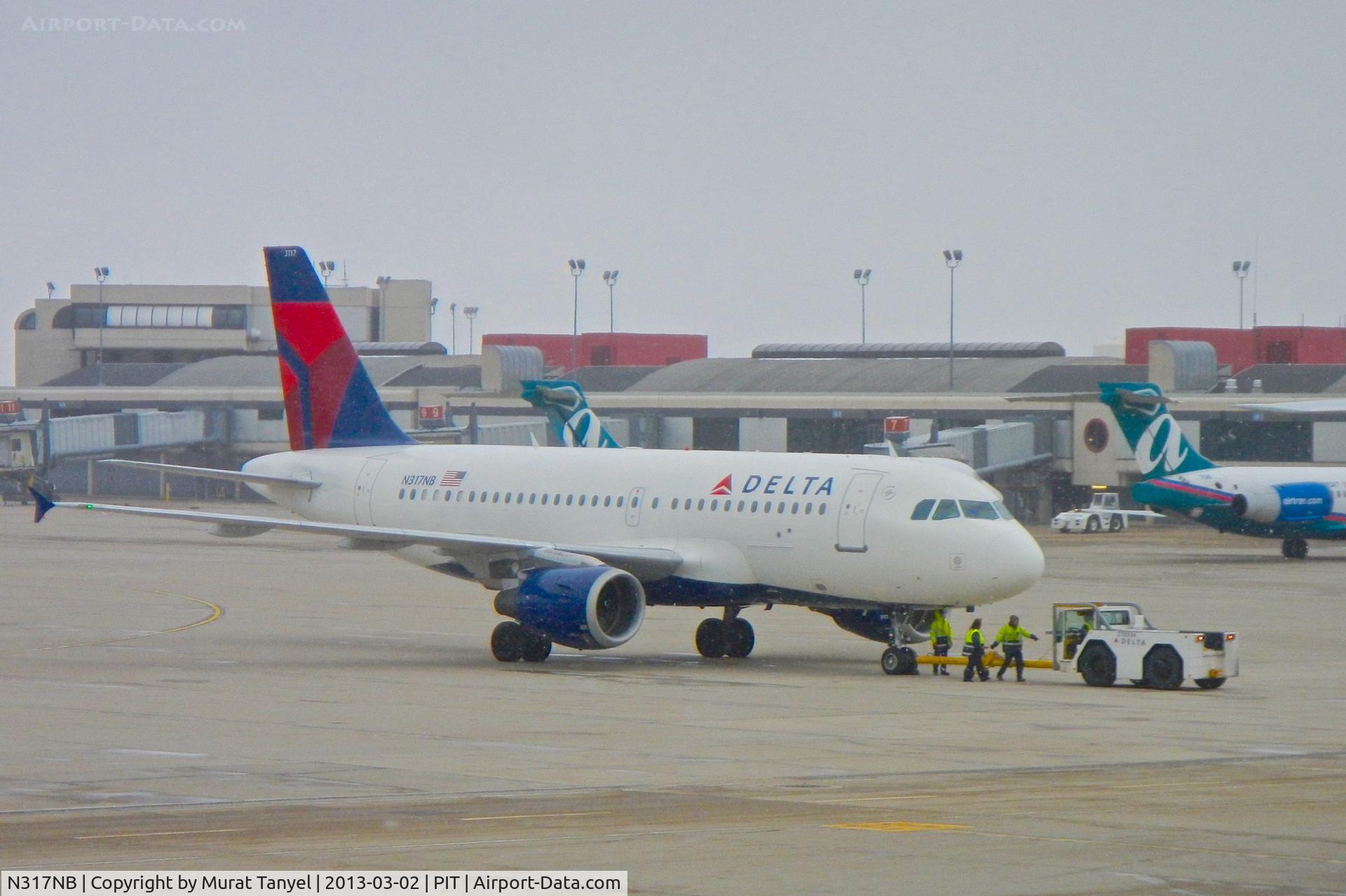 N317NB, 2000 Airbus A319-114 C/N 1324, Being towed @ PIT