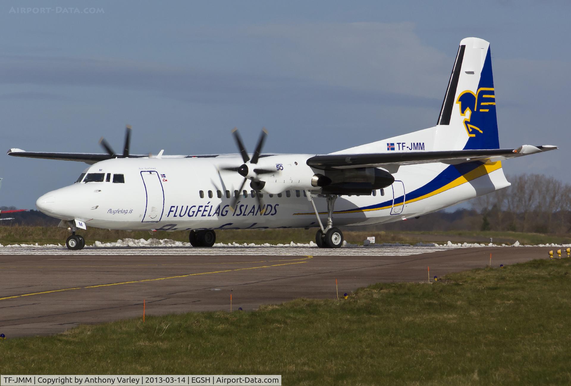 TF-JMM, 1991 Fokker 50 C/N 20214, Departing EGSH after spray by Air livery.