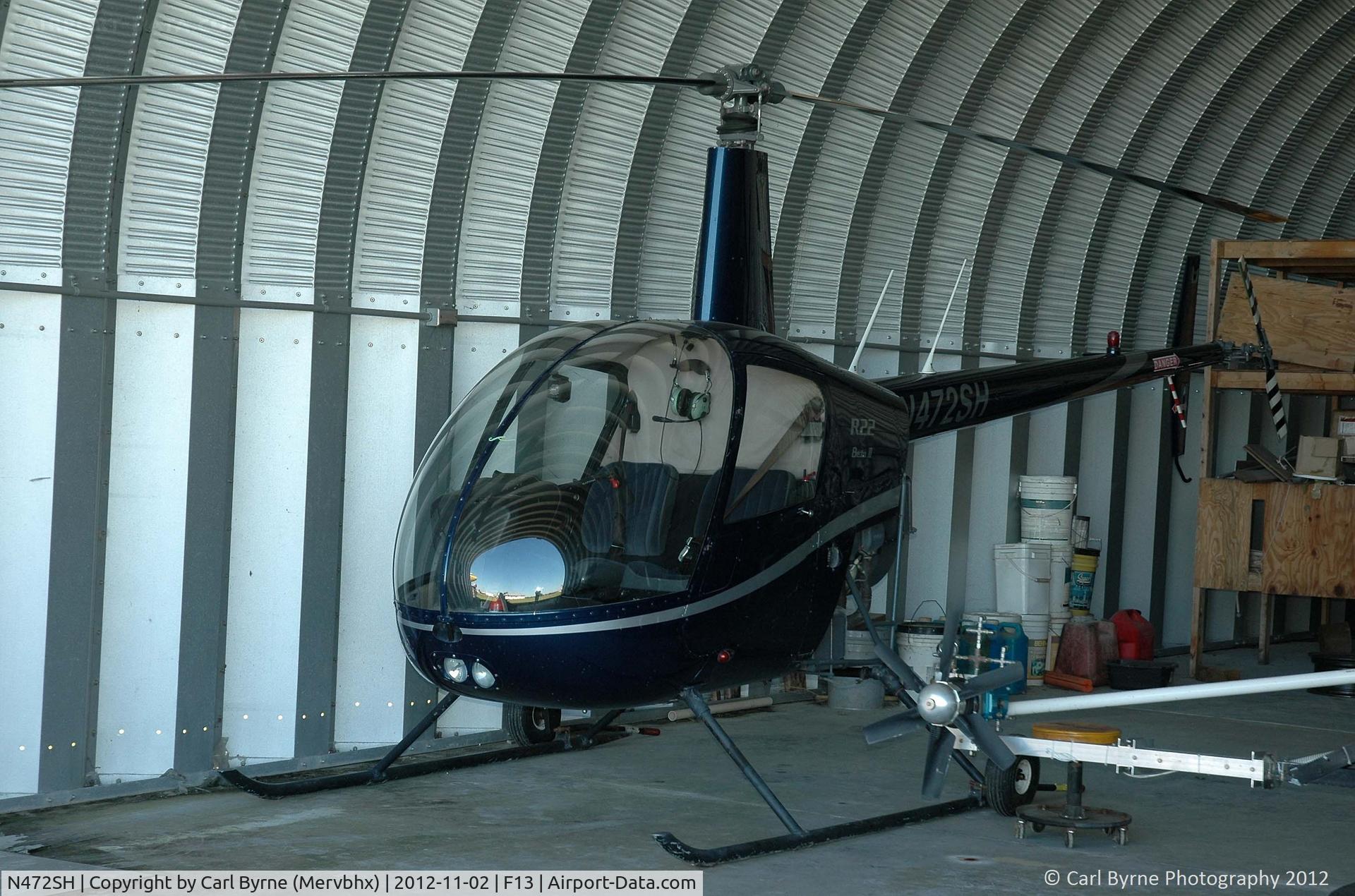 N472SH, 2006 Robinson R22 Beta C/N 4046, Inside one of the small hangars at Shell Creek Airpark.