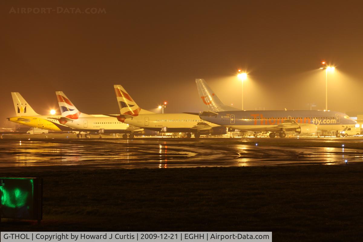 G-THOL, 1999 Boeing 737-36N C/N 28594, Thomsonfly, with two diverted British Airways 737s behind and a diverted Monarch Airbus to the left. 1943 local.
