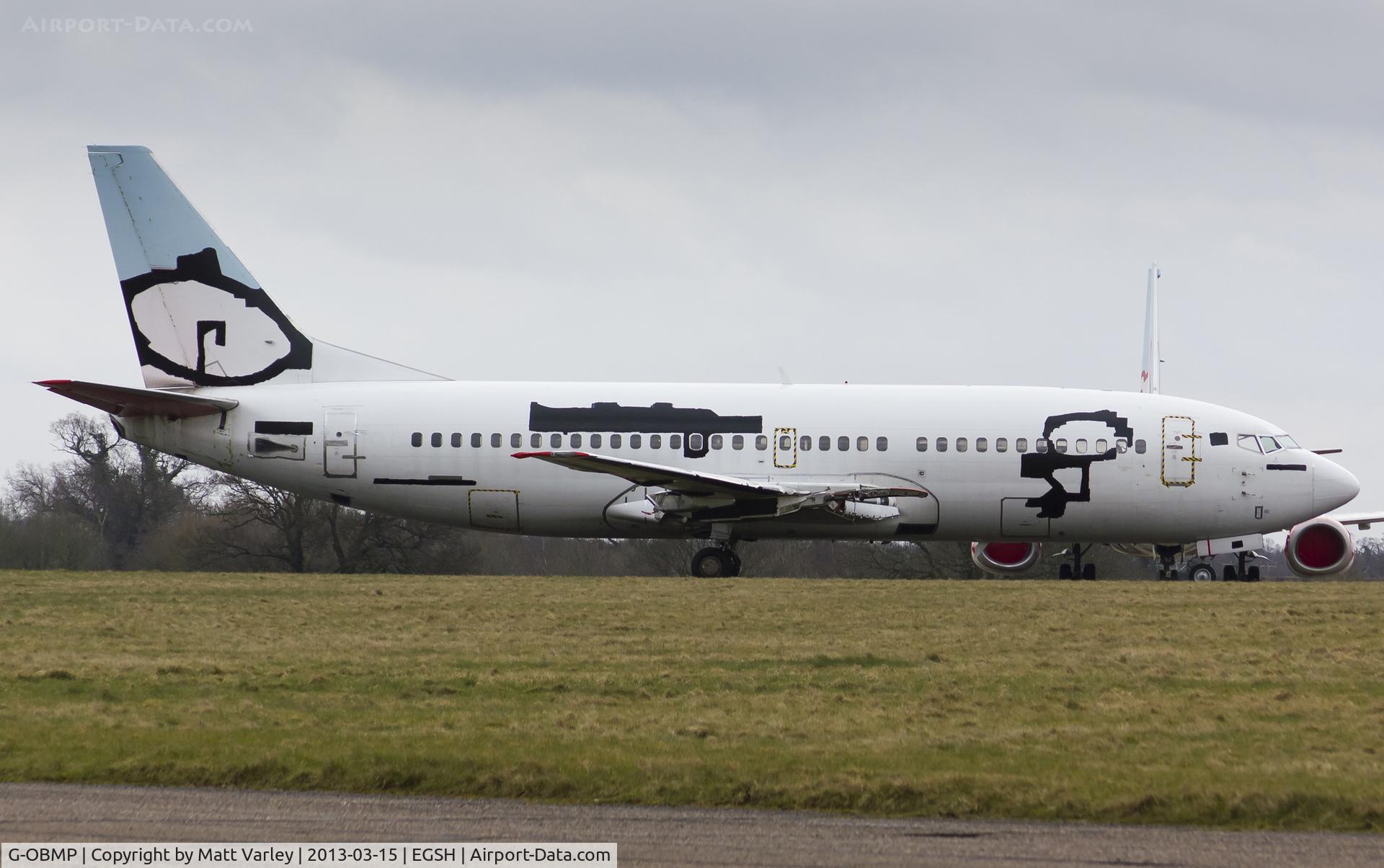 G-OBMP, 1992 Boeing 737-3Q8 C/N 24963, All covered up at NWI.