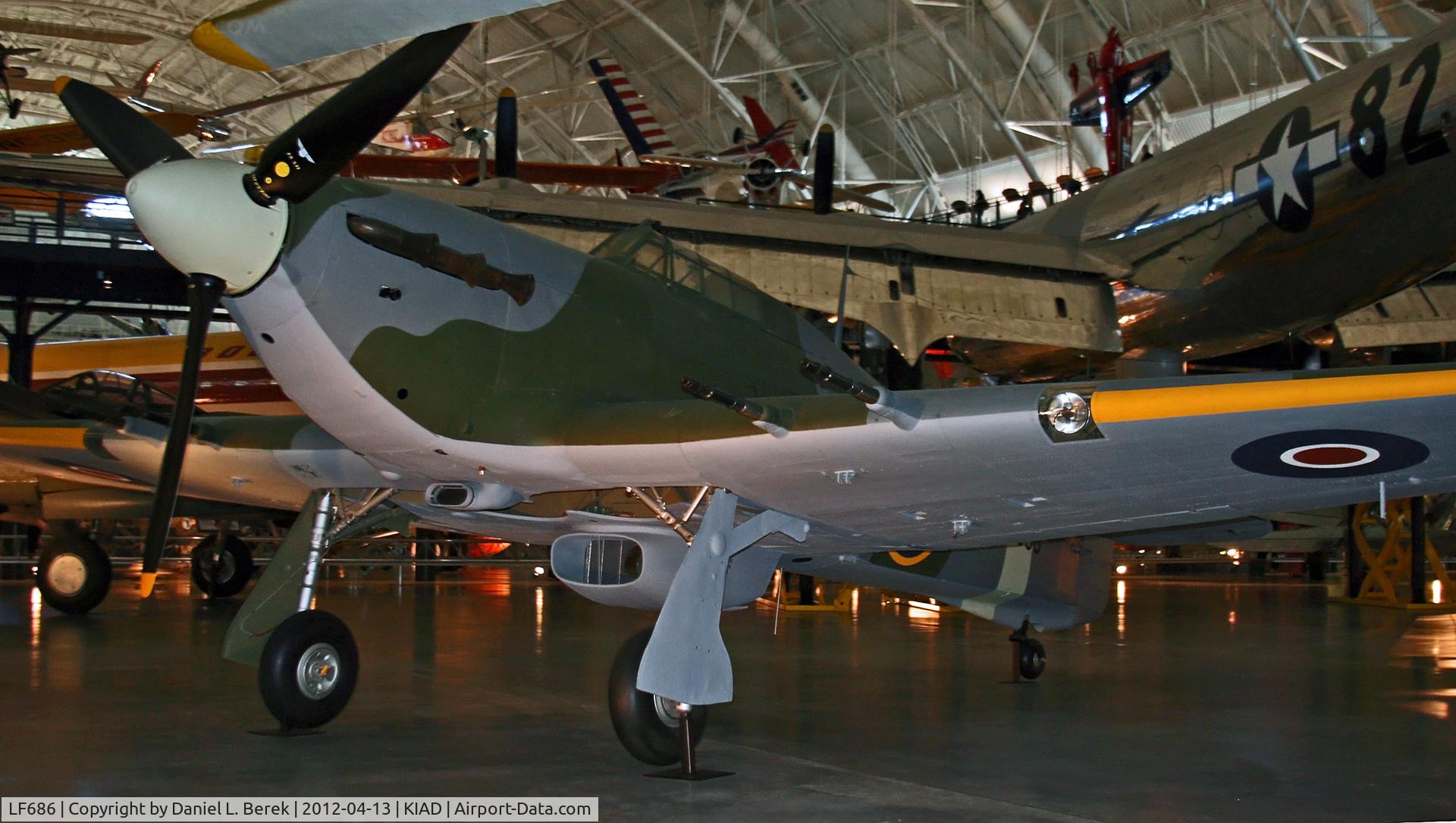 LF686, Hawker Hurricane IIC C/N Not found LF686, Hiding under the tail of Enola Gay.