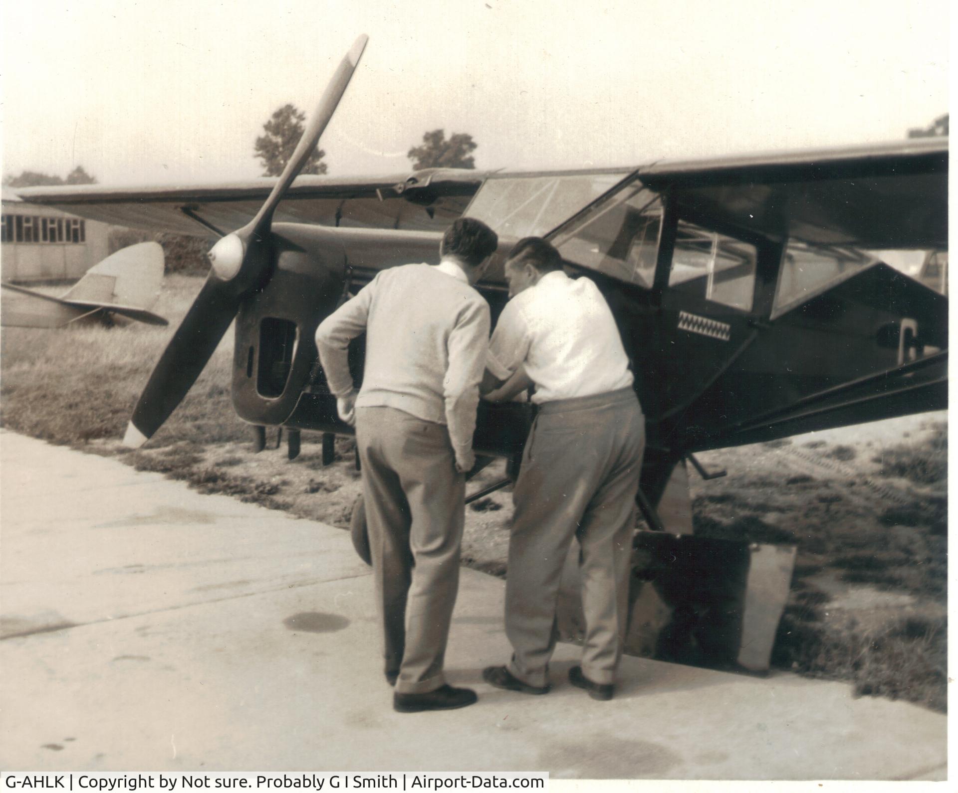 G-AHLK, 1943 Taylorcraft E Auster 3 C/N 700, Peewee Judge (right) and I'm not sure who, carrying out Auster repair on G-AHLK probably at Shoreham about 1960