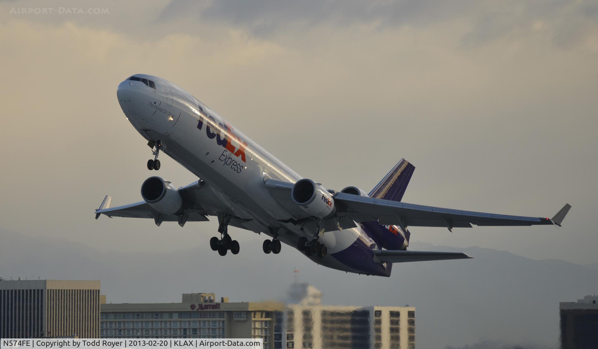 N574FE, 1991 McDonnell Douglas MD-11F C/N 48499, Early morning departure from LAX