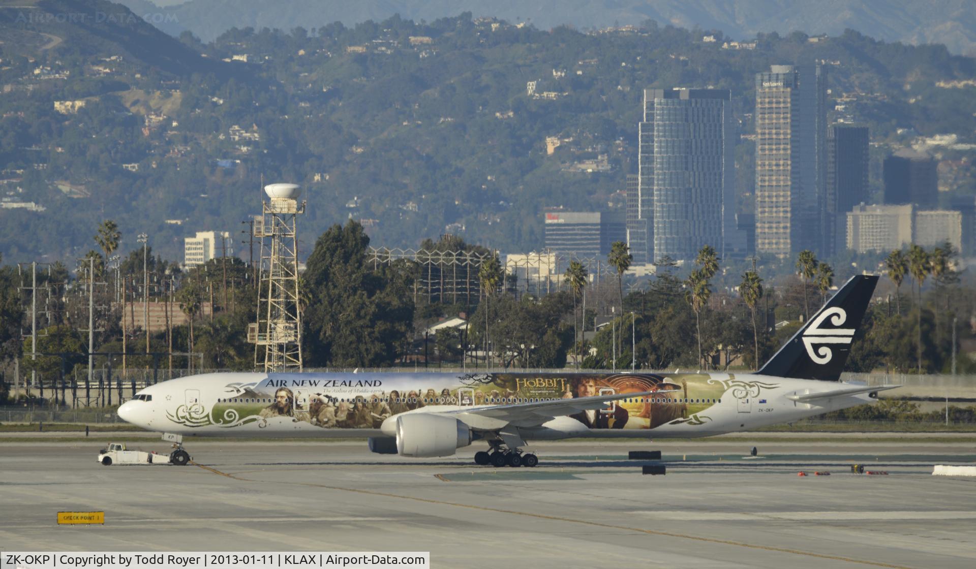 ZK-OKP, 2011 Boeing 777-306/ER C/N 39041, Getting a tow to parking at LAX