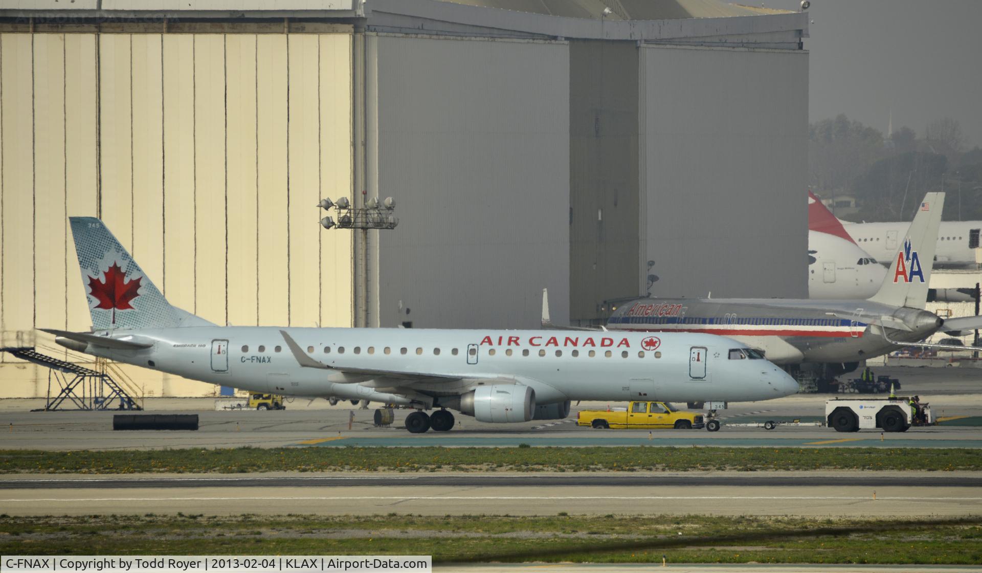 C-FNAX, 2008 Embraer 190AR (ERJ-190-100IGW) C/N 19000151, Getting towed to parking at LAX
