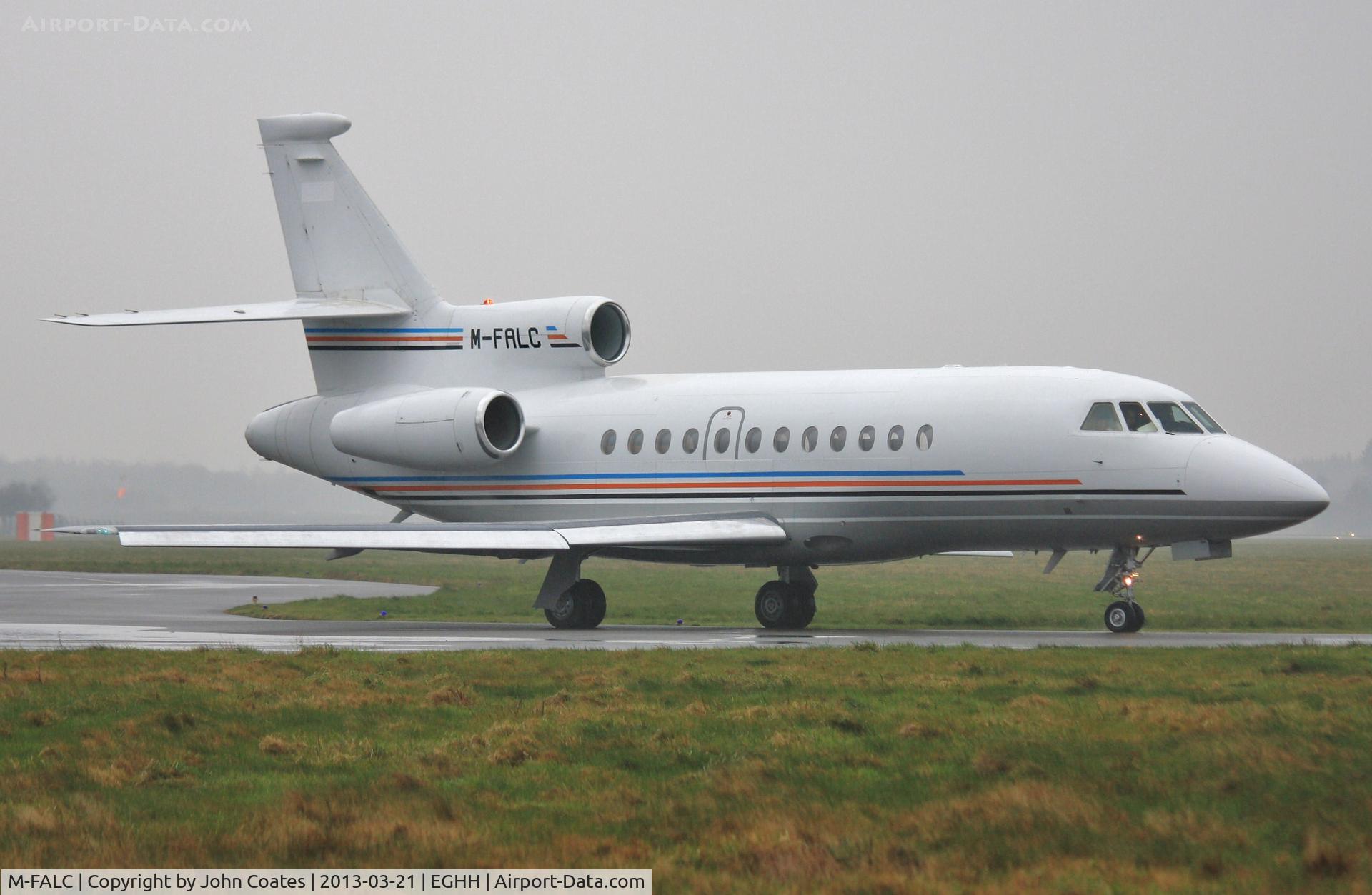 M-FALC, 1998 Dassault Falcon 900EX C/N 31, Departing in pouring rain