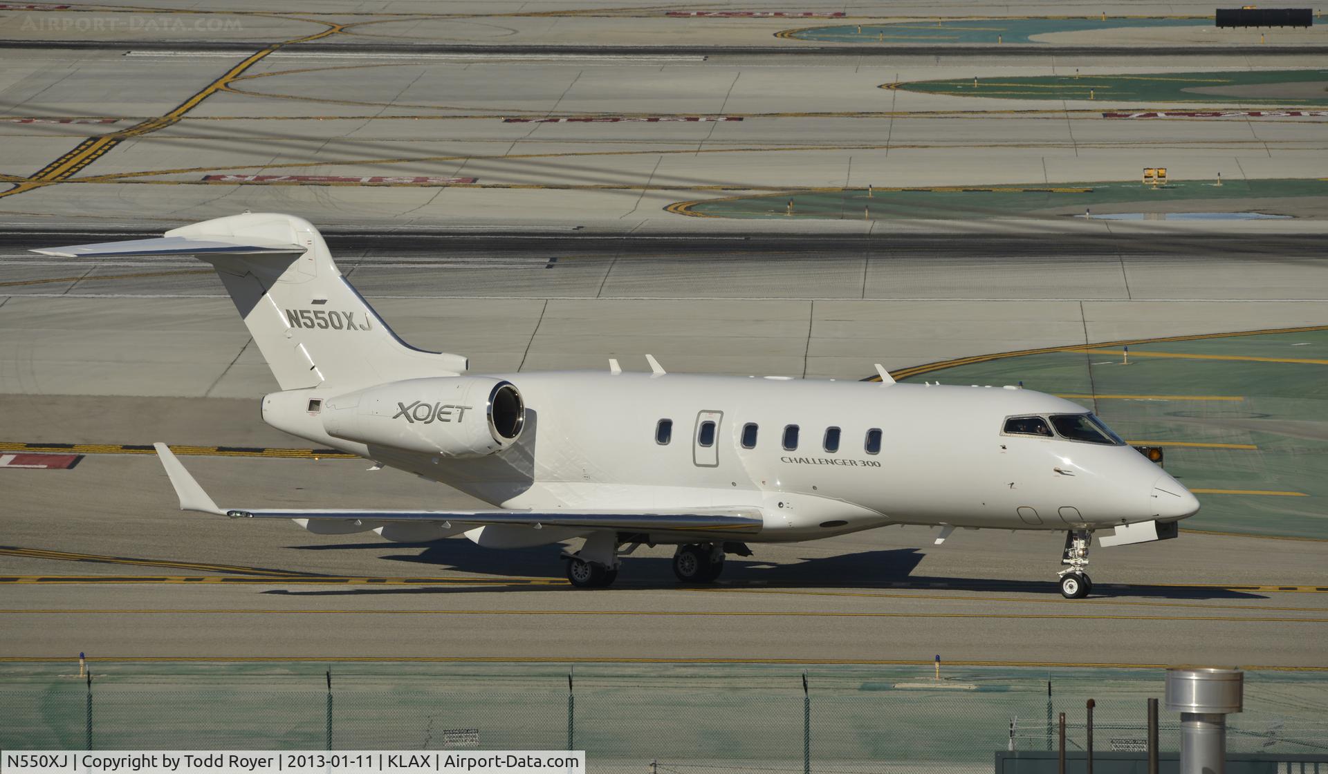 N550XJ, 2011 Bombardier Challenger 300 (BD-100-1A10) C/N 20323, Taxiing to parking at LAX