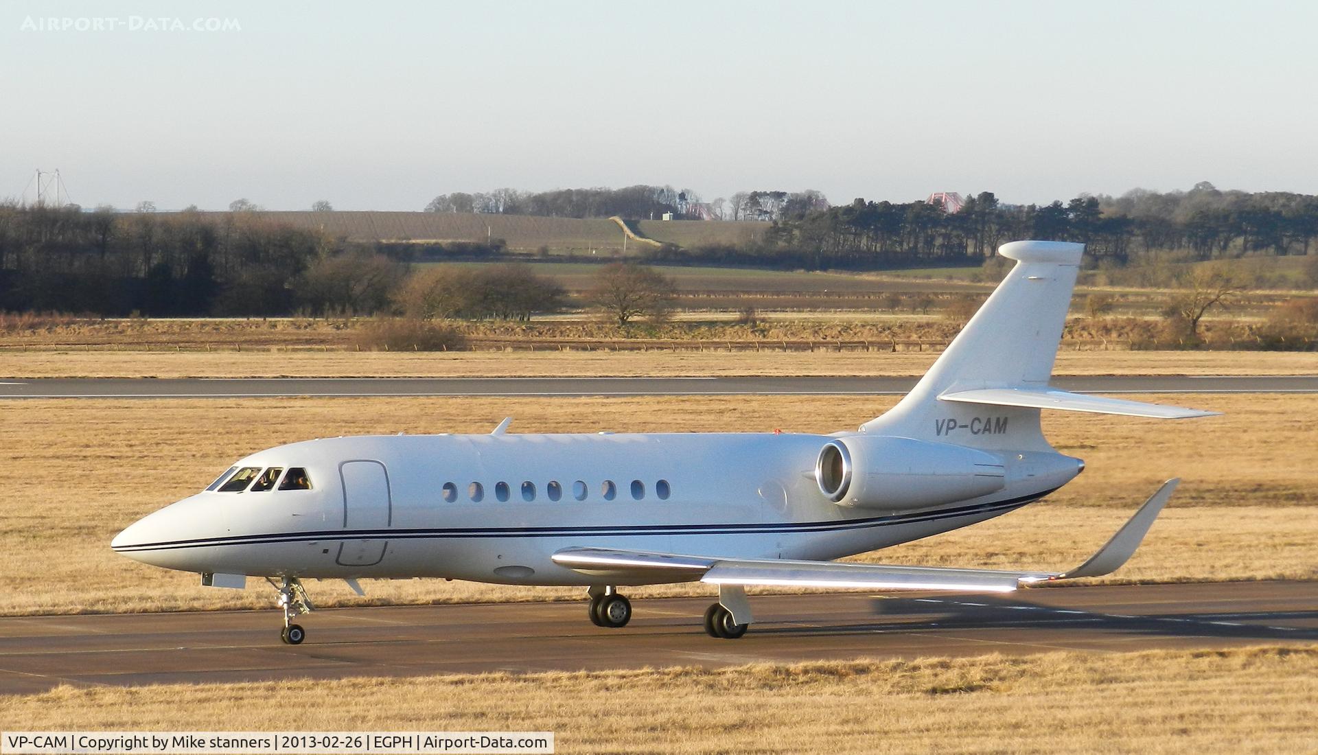 VP-CAM, 2011 Dassault Falcon 2000LX C/N 234, Delta Technical Services Falcon 2000 taxiing to runway 06