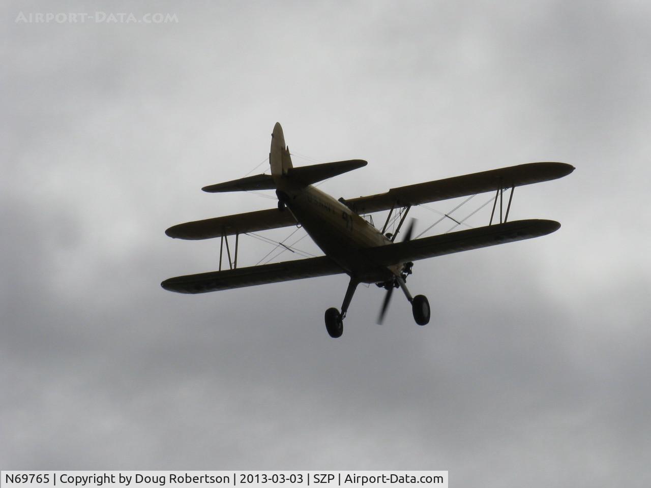 N69765, 1941 Boeing A75N1 (PT17) C/N 75-1044, 1941 Boeing Stearman A75N1 as Navy N2S-1, Continental W670 220 Hp radial, takeoff climb Rwy 22