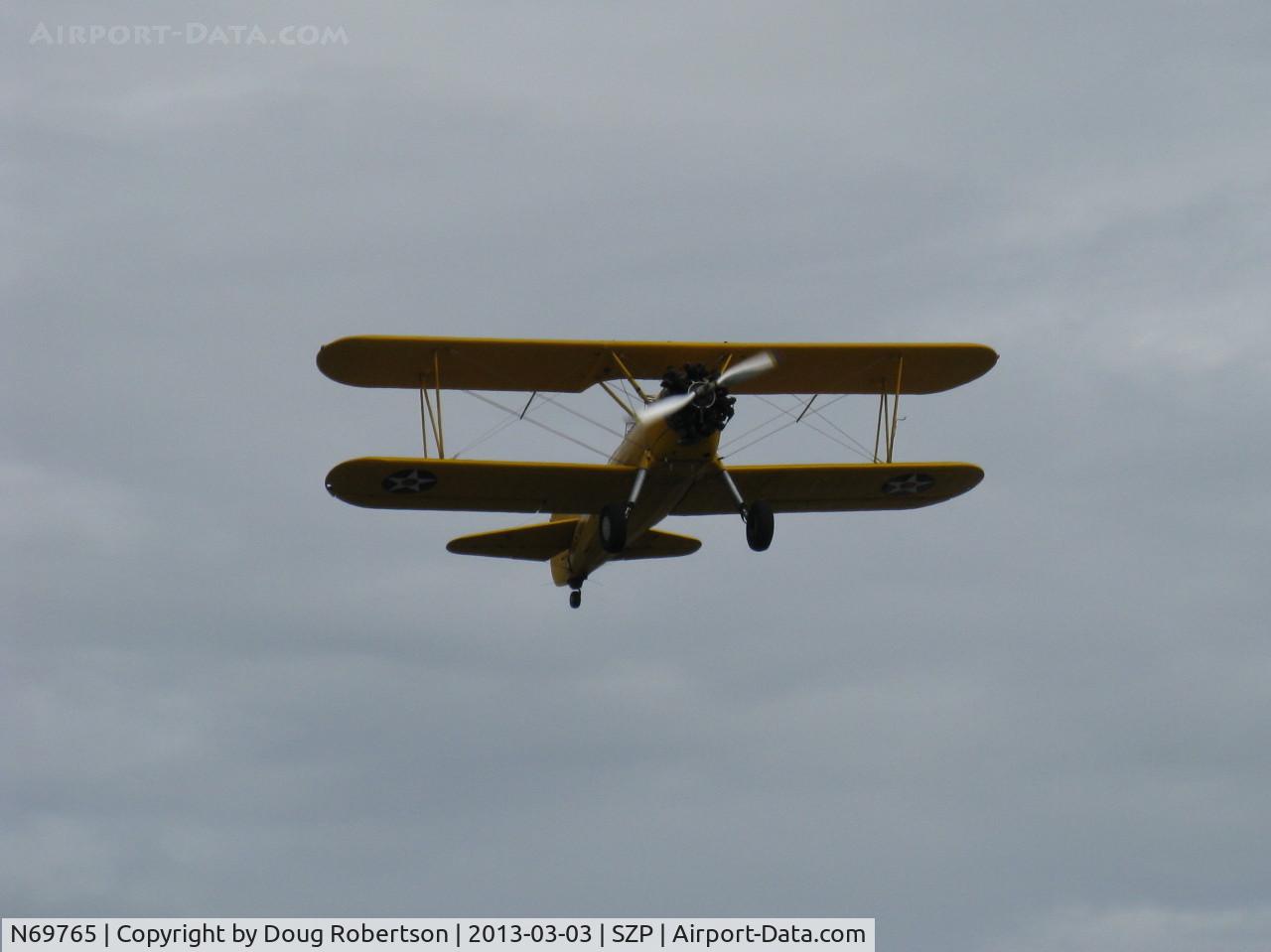N69765, 1941 Boeing A75N1 (PT17) C/N 75-1044, 1941 Boeing Stearman A75N1 as Navy N2S-1, Continental W670 220 Hp, takeoff climb Rwy 22