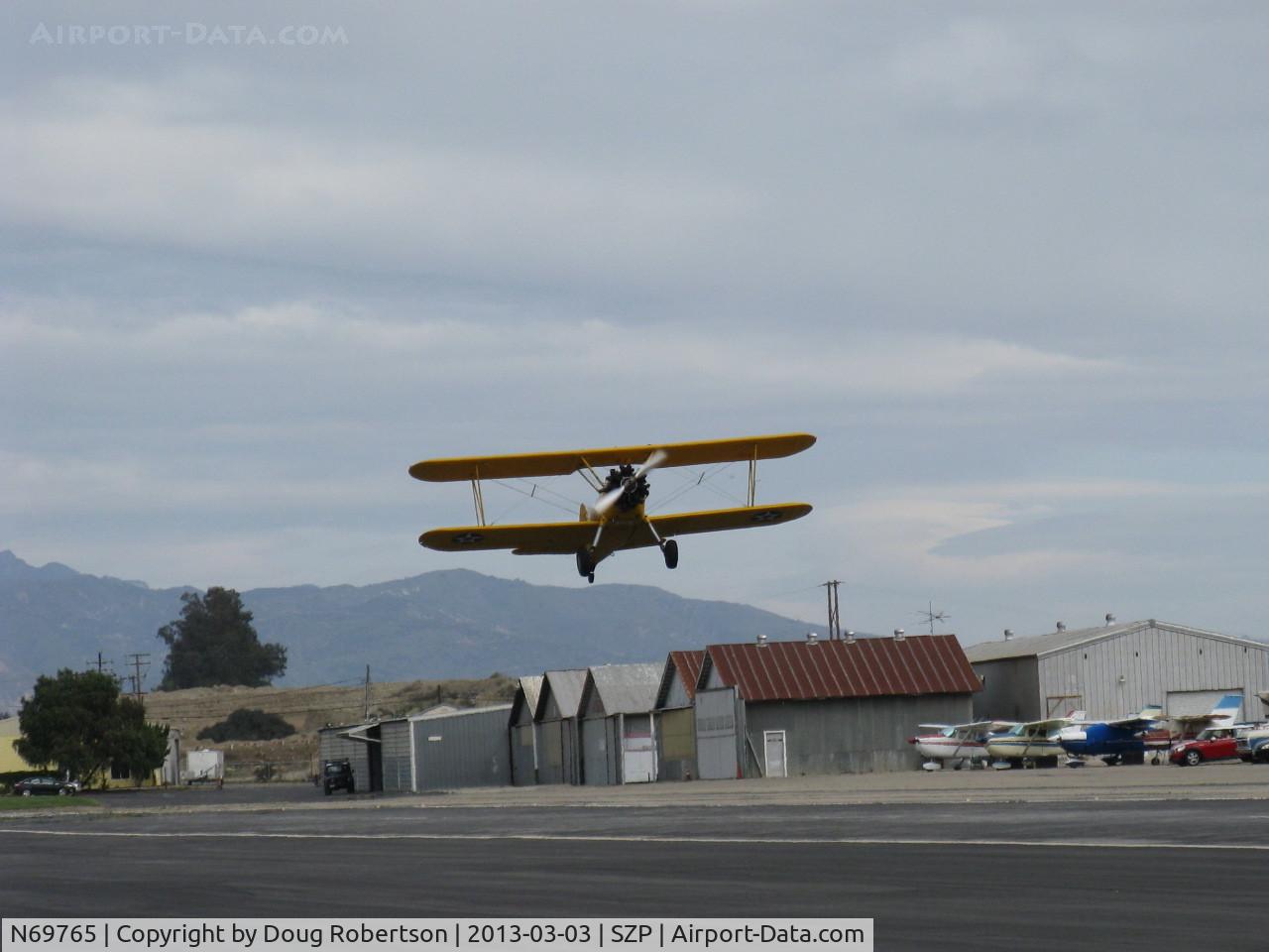 N69765, 1941 Boeing A75N1 (PT17) C/N 75-1044, 1941 Boeing Stearman A75N1 as Navy N2S-1, Continental W670 220 Hp radial, takeoff climb Rwy 22