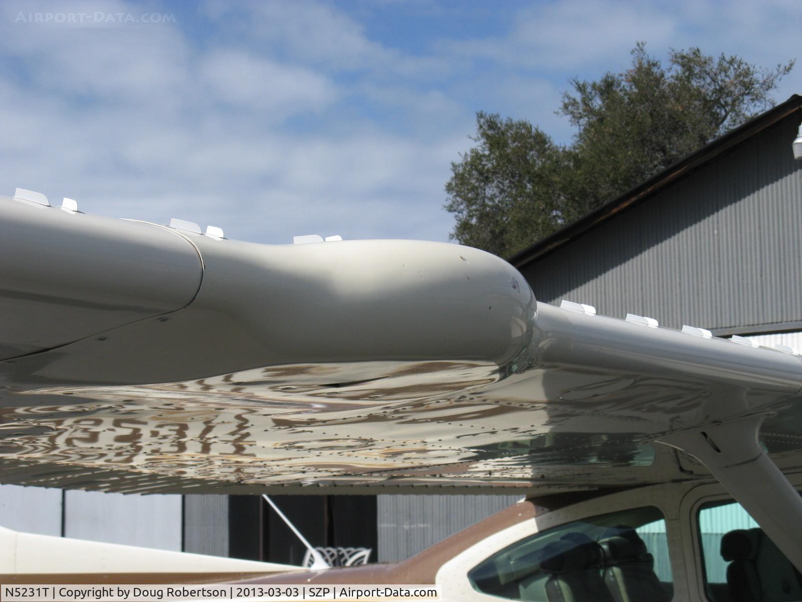 N5231T, 1981 Cessna R182 Skylane RG C/N R18201839, 1981 Cessna R182 SKYLANE RG, Lycoming O-540-J3C5D 235 Hp, owner states the wing hump is his 'spare tire compartment'-I reveal it's a fairing over removed wing RADAR. Note Micro vortex generators.