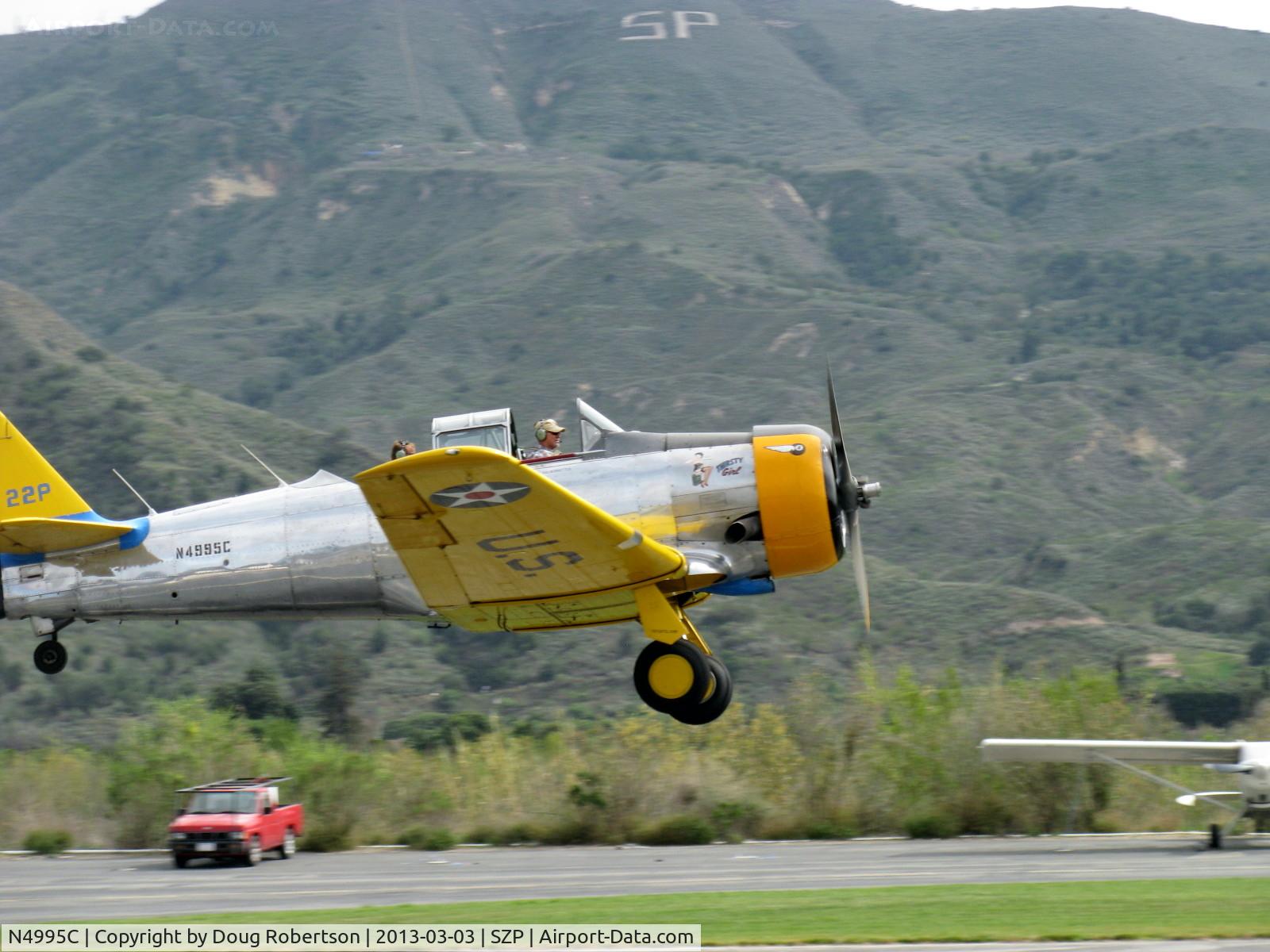 N4995C, 1949 North American T-6G Texan C/N 168-481, 1949 North American T-6G TEXAN 'Thirsty Girl', P&W R-1340 Wasp 600 Hp, 1949 Factory remanufacture, takeoff climb Rwy 22