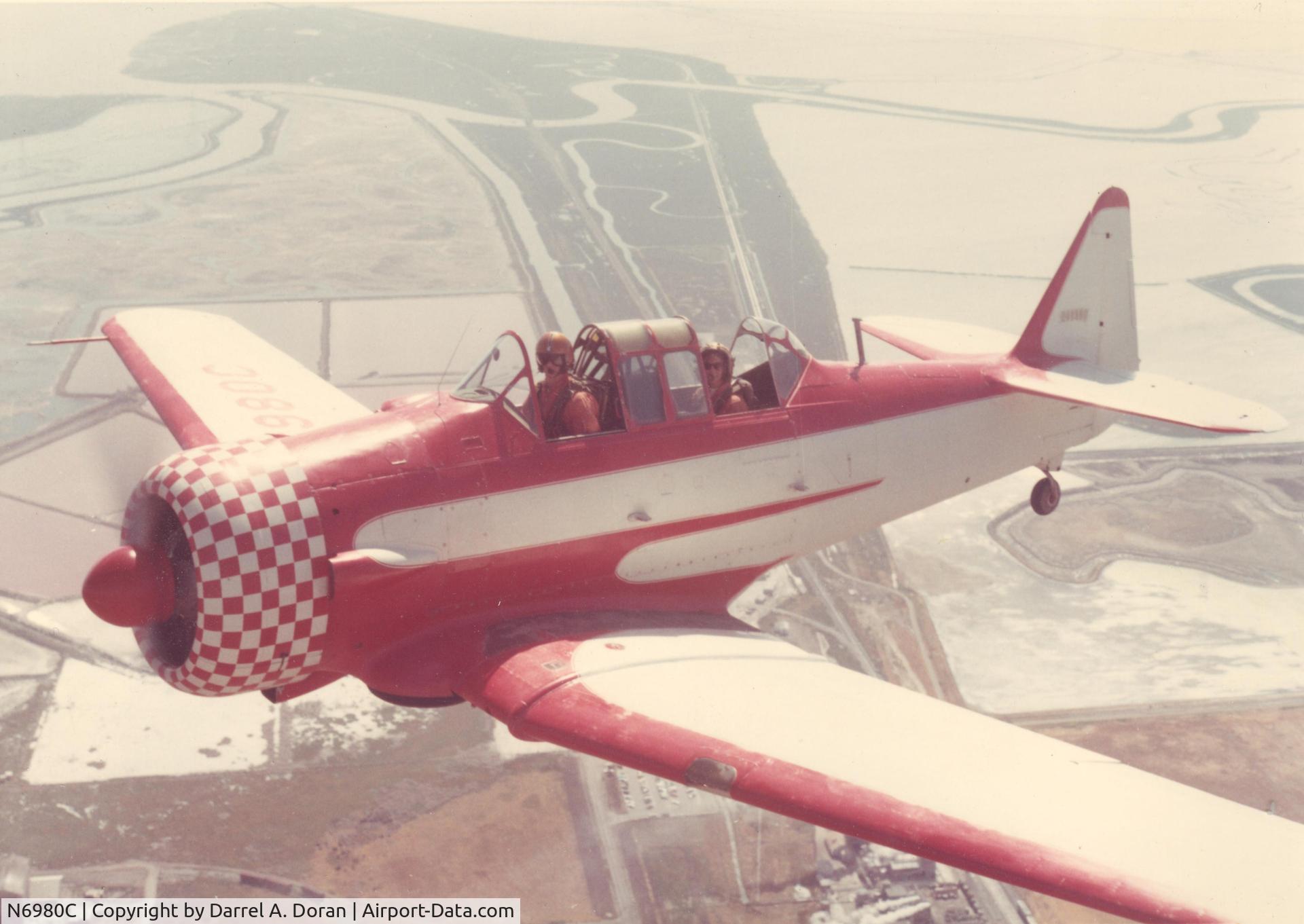 N6980C, 1944 North American AT-6D-ND C/N 44-81480 (121-42202}, Fremont Salt Ponds, San Francisco Bay area, late 1960's
