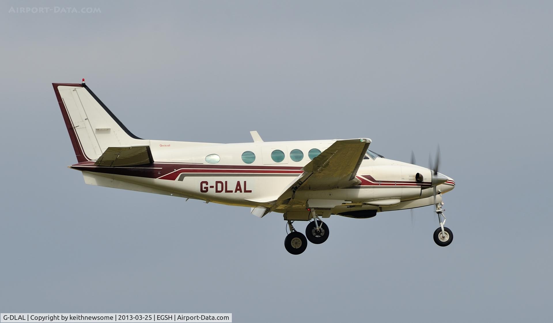 G-DLAL, 1976 Beech E90 King Air C/N LW-187, Landing onto 09 in strong wind.
