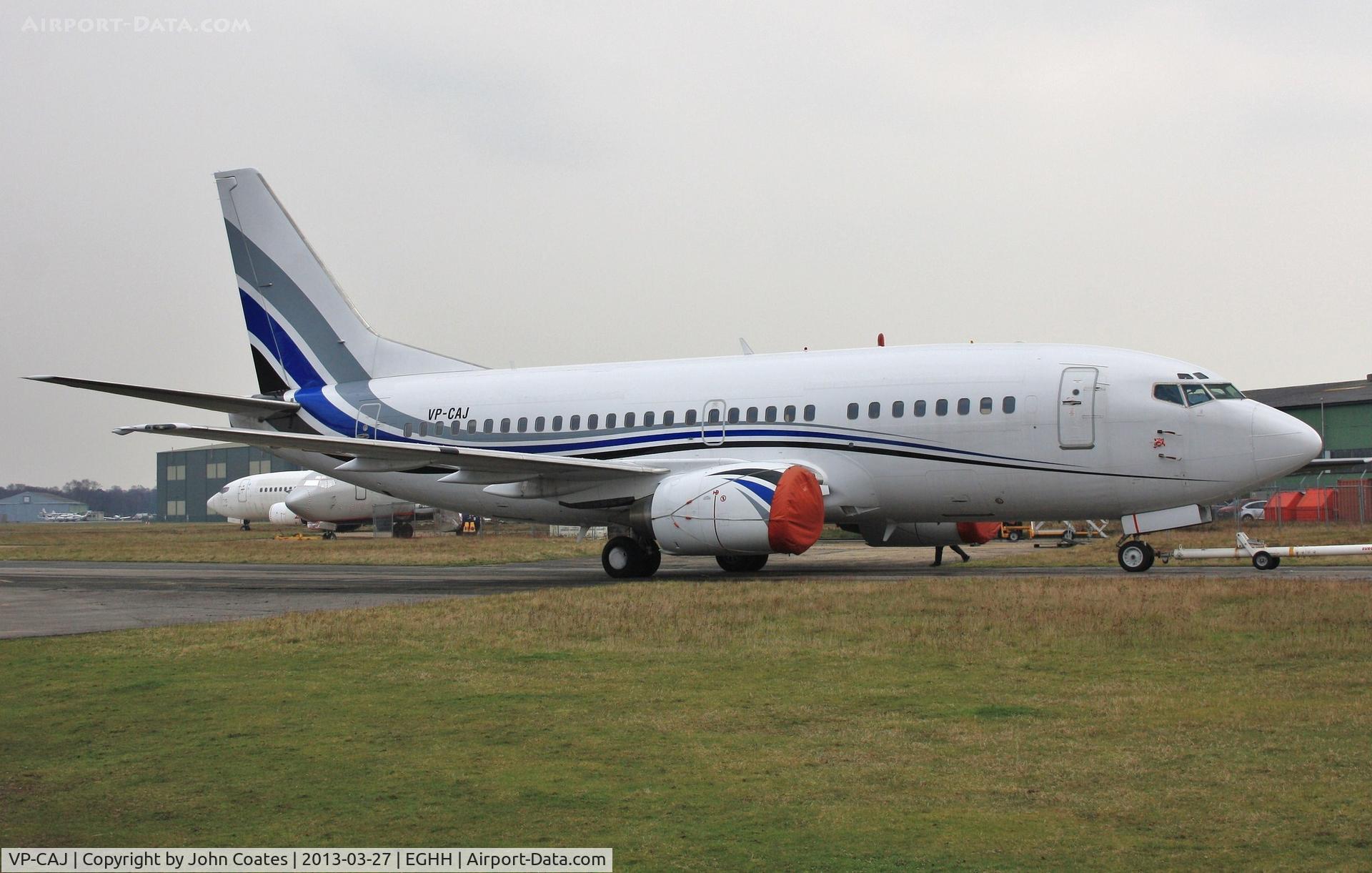 VP-CAJ, 1992 Boeing 737-505 C/N 24648, European Skybus LLC's 737 being pushed back to allow SX-BHR out of the service bay