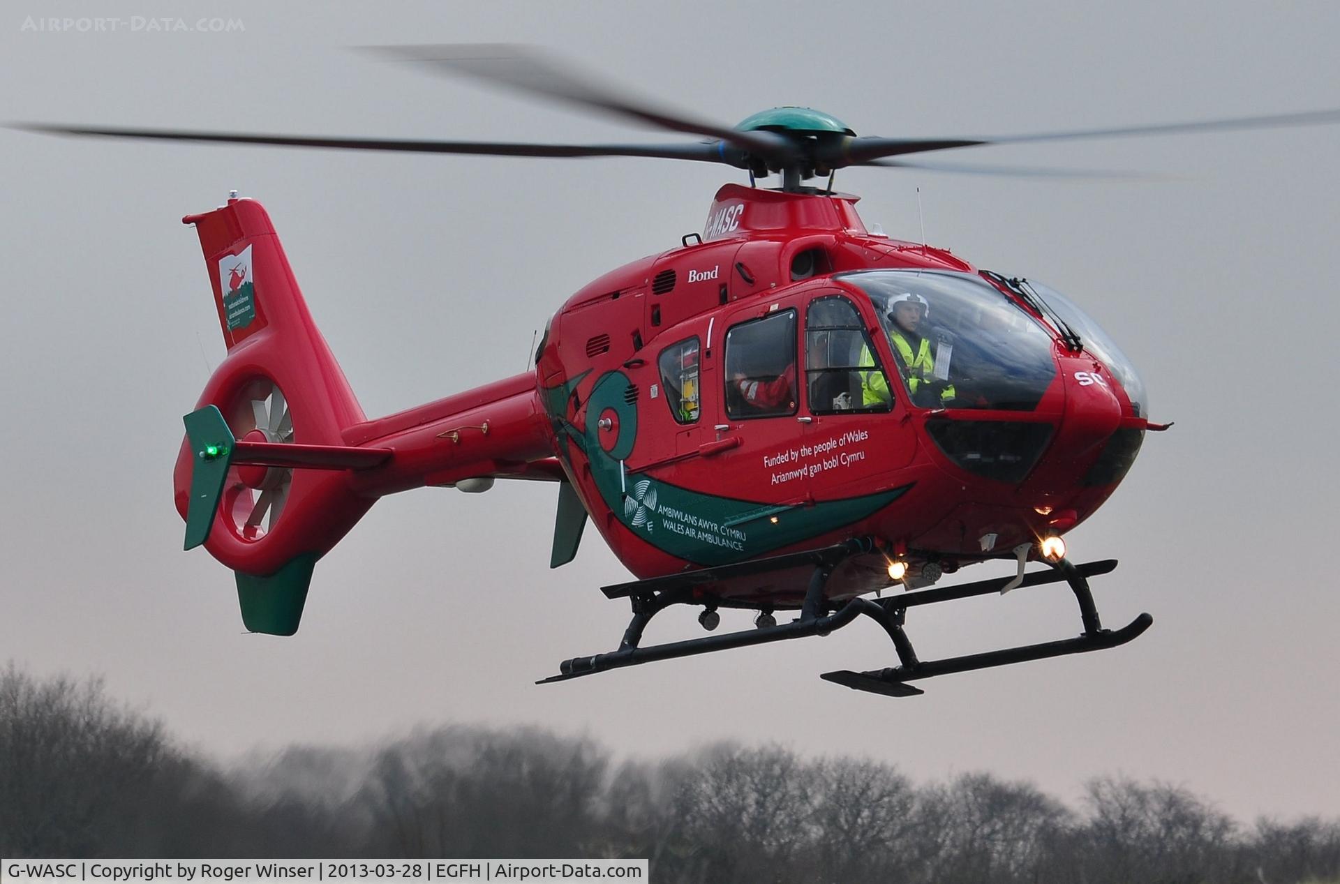 G-WASC, 2012 Eurocopter EC-135T-2+ C/N 1074, Helimed 59, the Welshpool Airport based Wales Air Ambulance helicopter drops into Swansea Airport to take on fuel. The weather RADAR equiped helicopter responded to the first night-time emergency by the Wales Air Ambulance service on 25 March 2013.