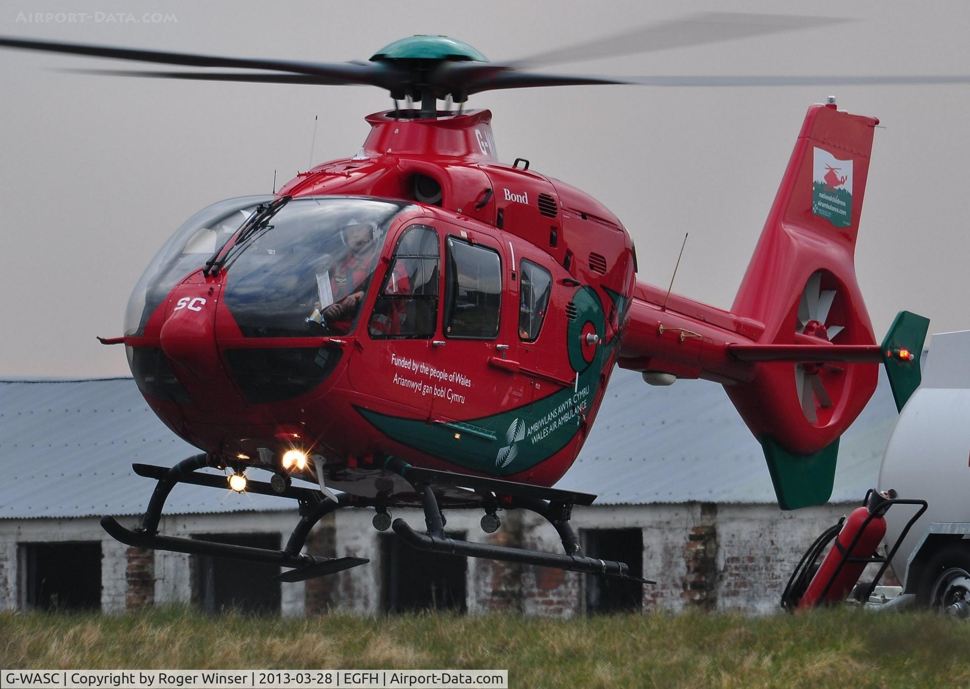 G-WASC, 2012 Eurocopter EC-135T-2+ C/N 1074, Welshpool Airport based Mid-Wales Air Ambulance helicopter (Helimed 59) drops into the South Wales Air Ambulance base to take on fuel.