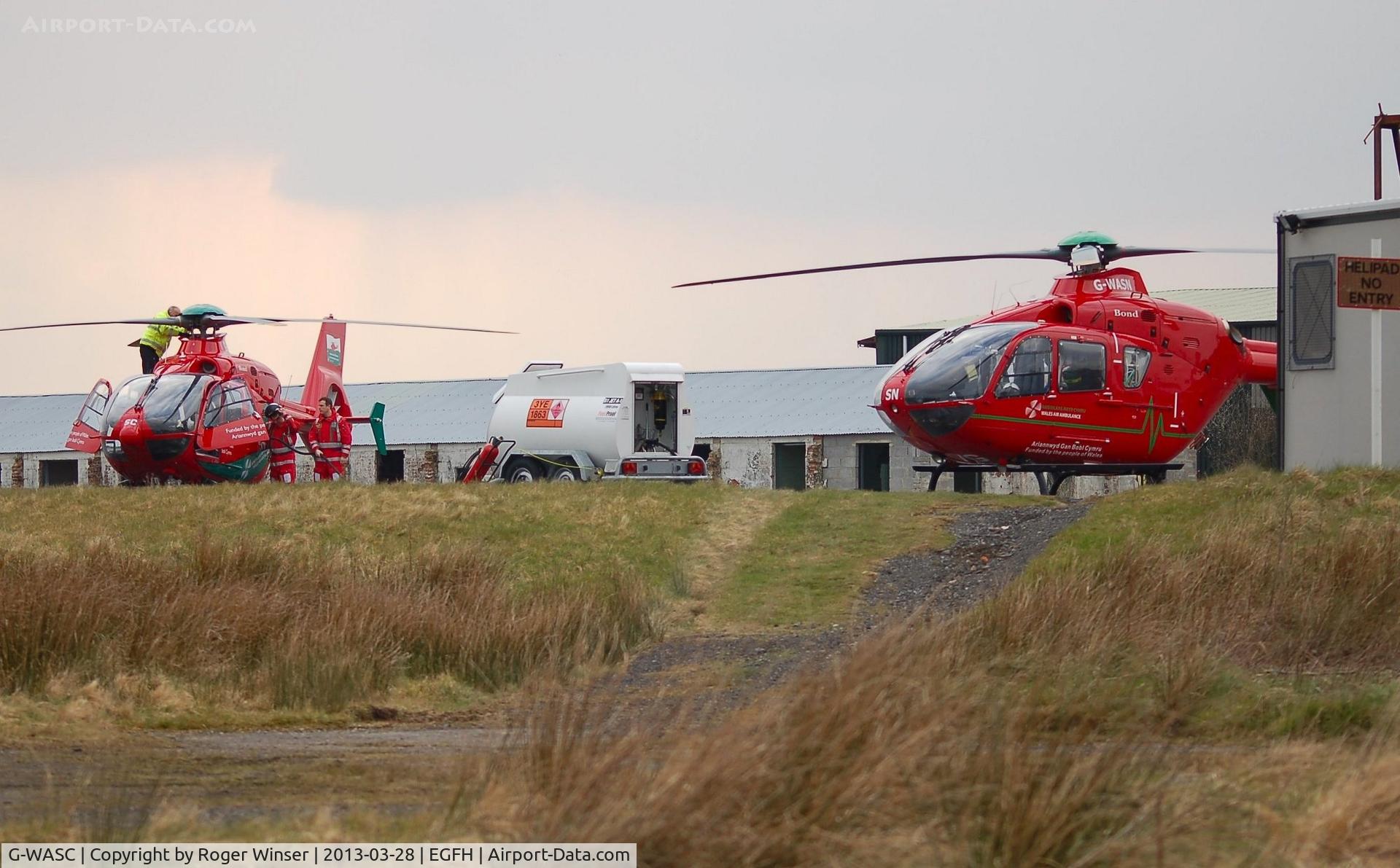 G-WASC, 2012 Eurocopter EC-135T-2+ C/N 1074, Mid-Wales Air Ambulance helicopter (Helimed 59) taking on fuel at Swansea Airport.